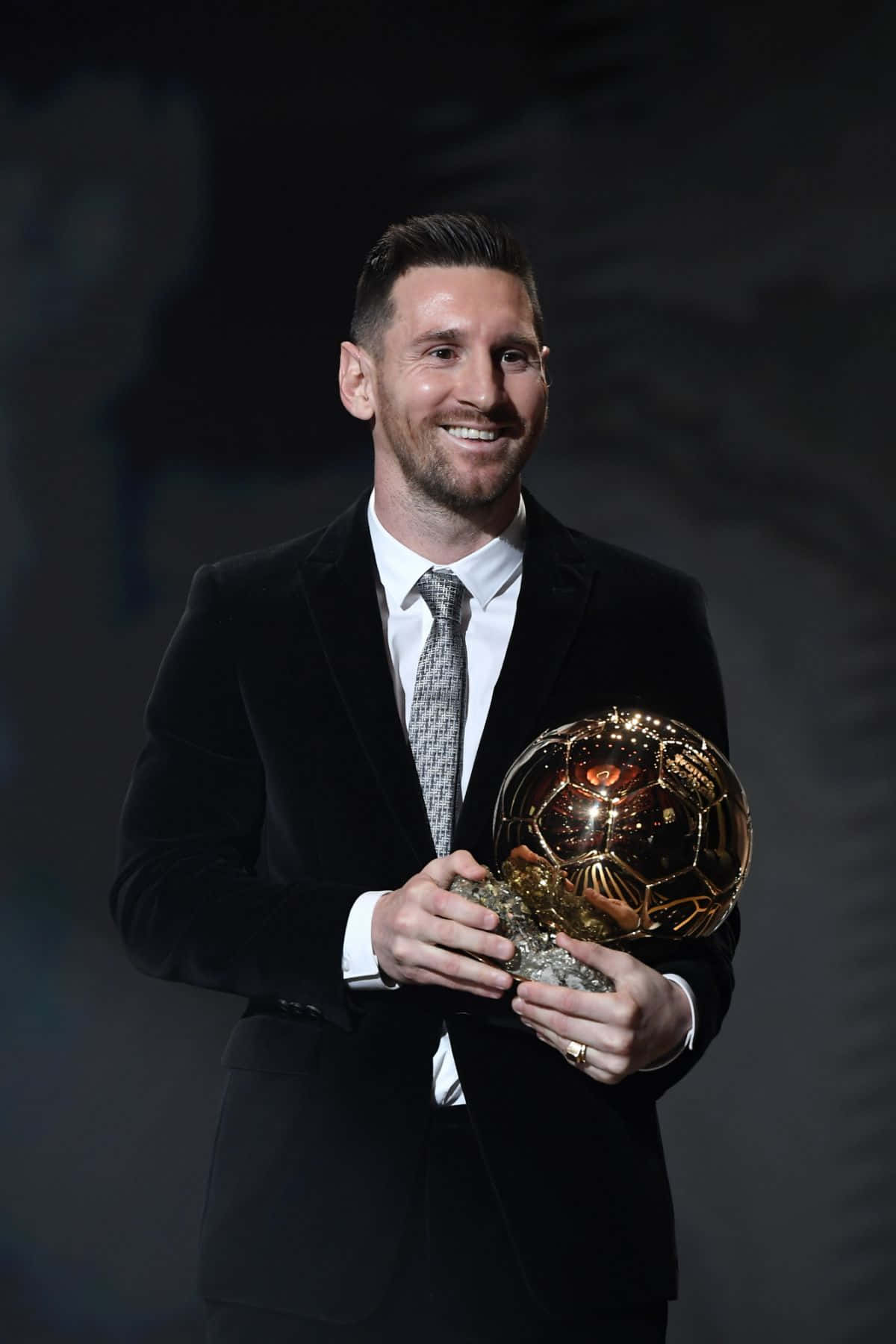 Elegant Soccer Star With Golden Ball Award Wallpaper