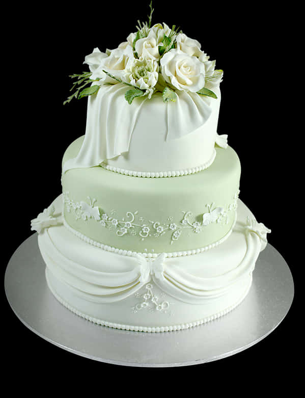Elegant Three Tier Wedding Cakewith Floral Topper PNG