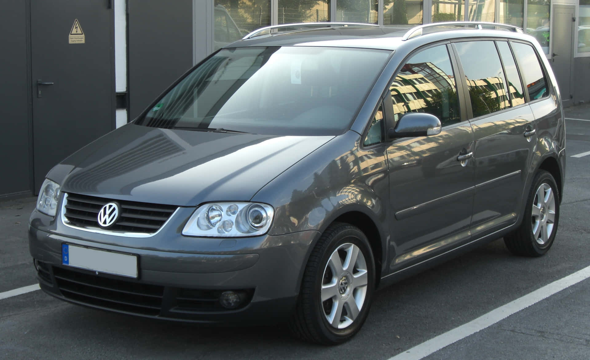 Elegant Volkswagen Touran In Action Wallpaper