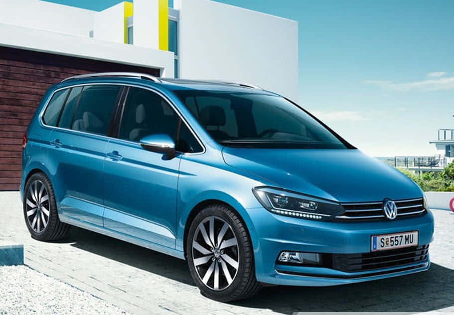 Elegant Volkswagen Touran In Urban Environment Wallpaper