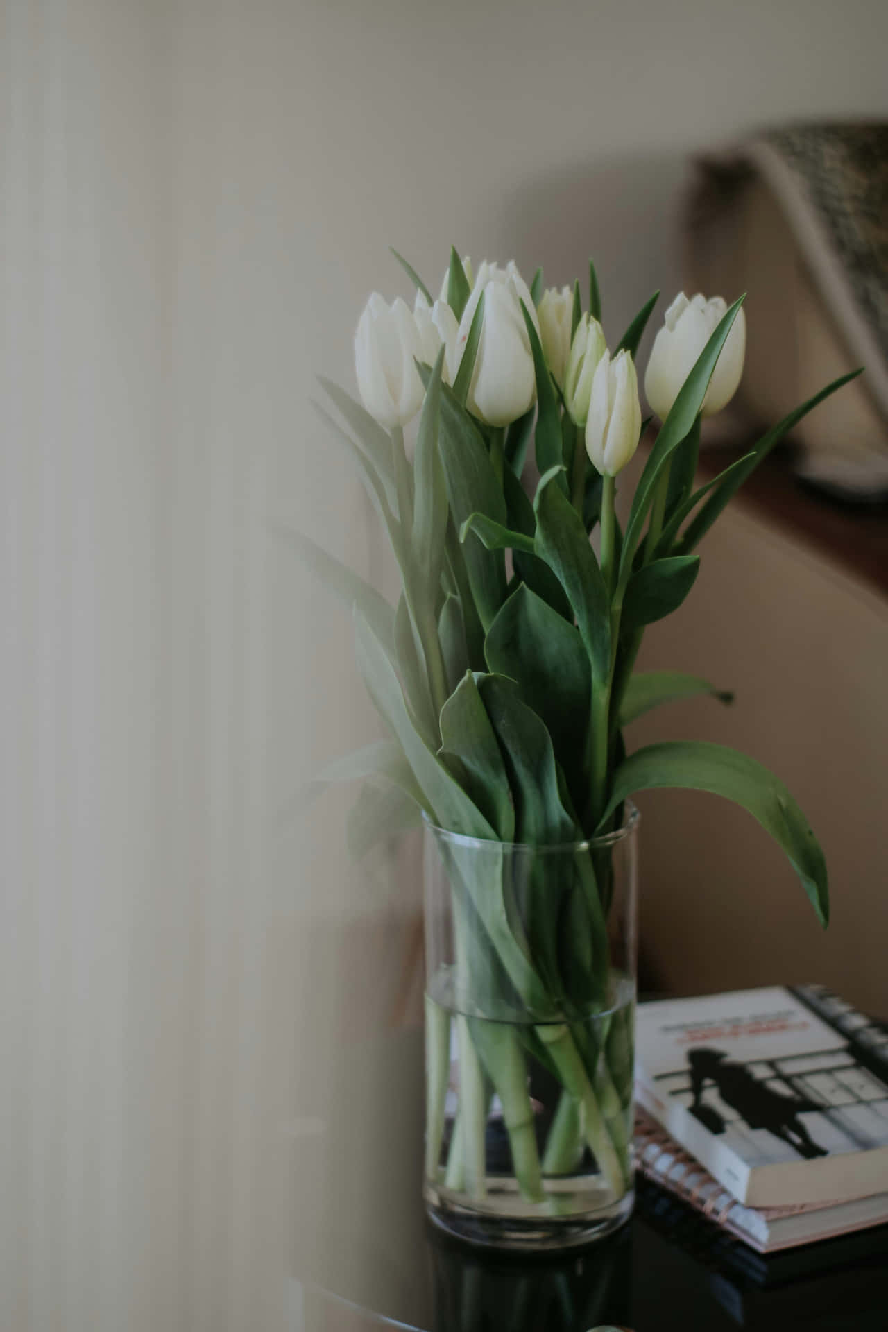 Elegant White Tulipsin Glass Vase Wallpaper