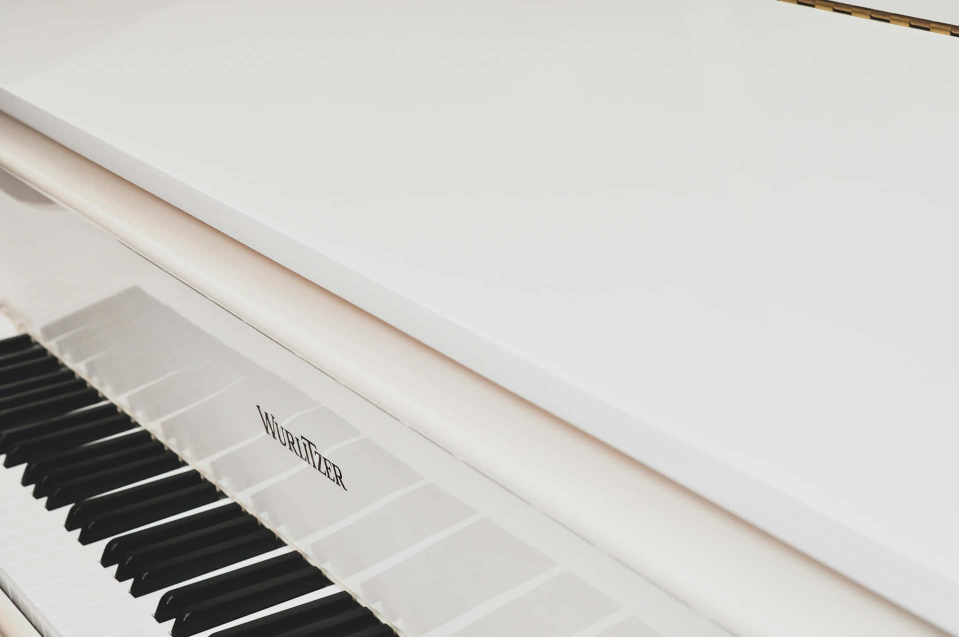 Elegant White Wurlitzer Piano Wallpaper