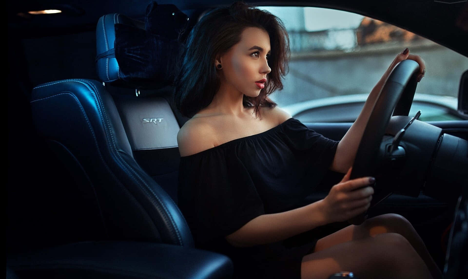 Elegant Woman Driving Car Night Wallpaper