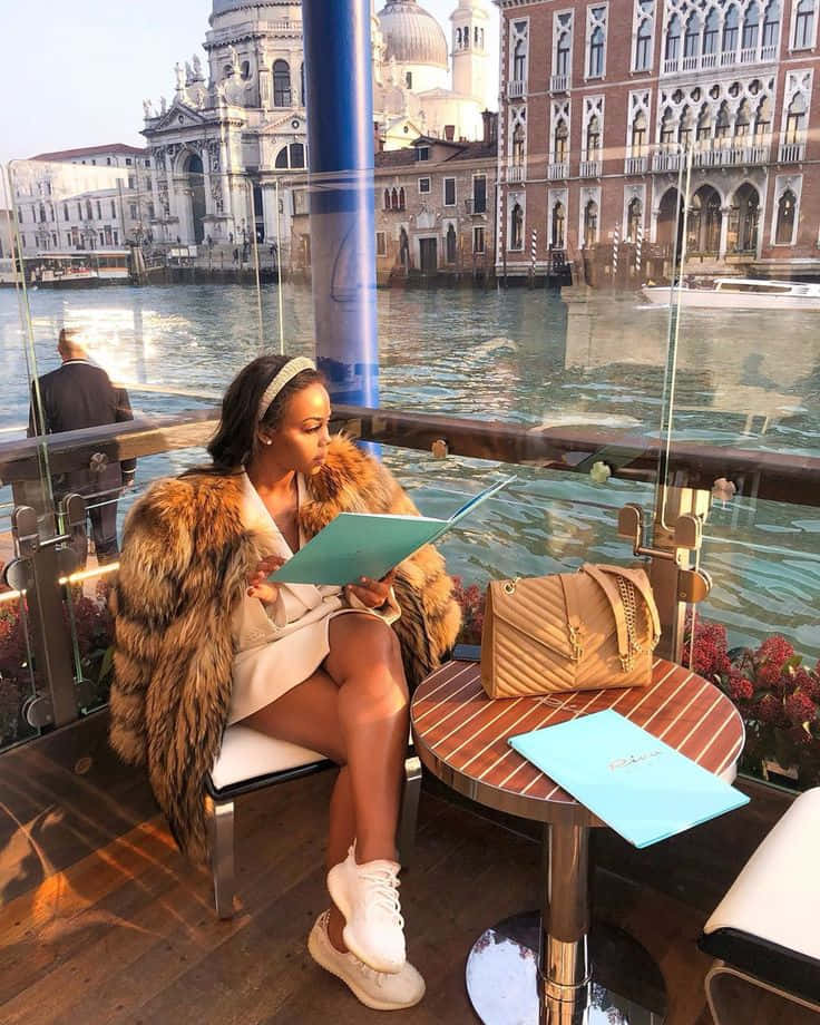 Elegant Woman Enjoying Venice Waterfront Wallpaper