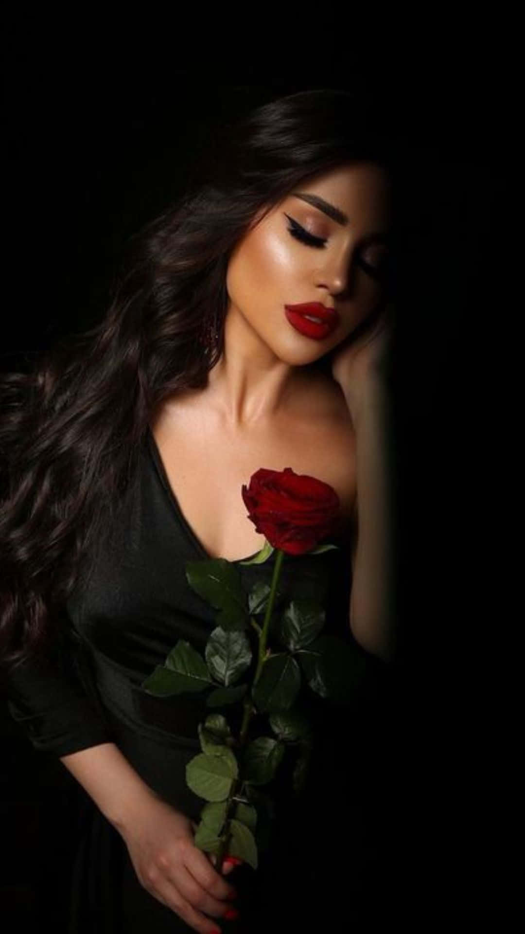 Elegant_ Woman_with_ Red_ Rose Wallpaper