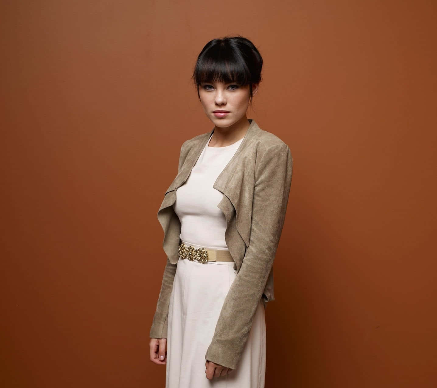 Elegant Womanin Beige Outfit Wallpaper