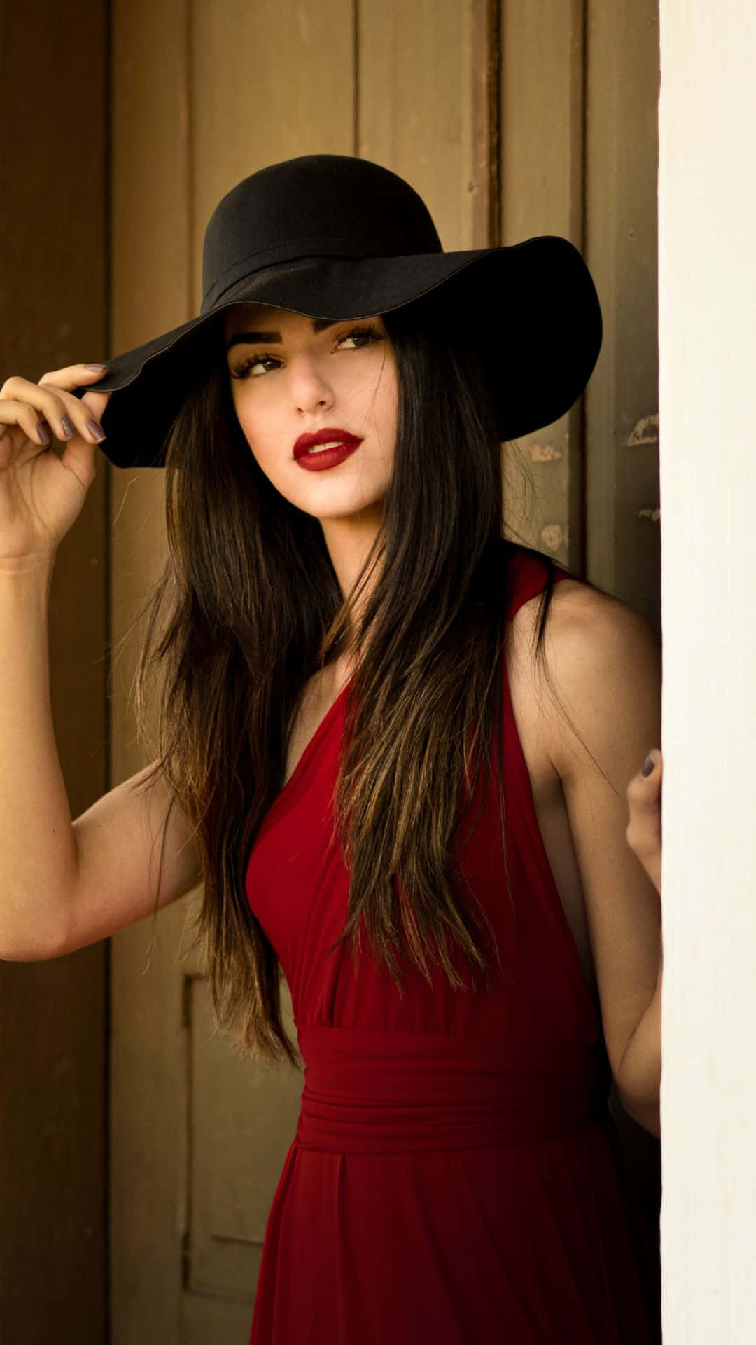 Elegant Womanin Red Dressand Hat Wallpaper