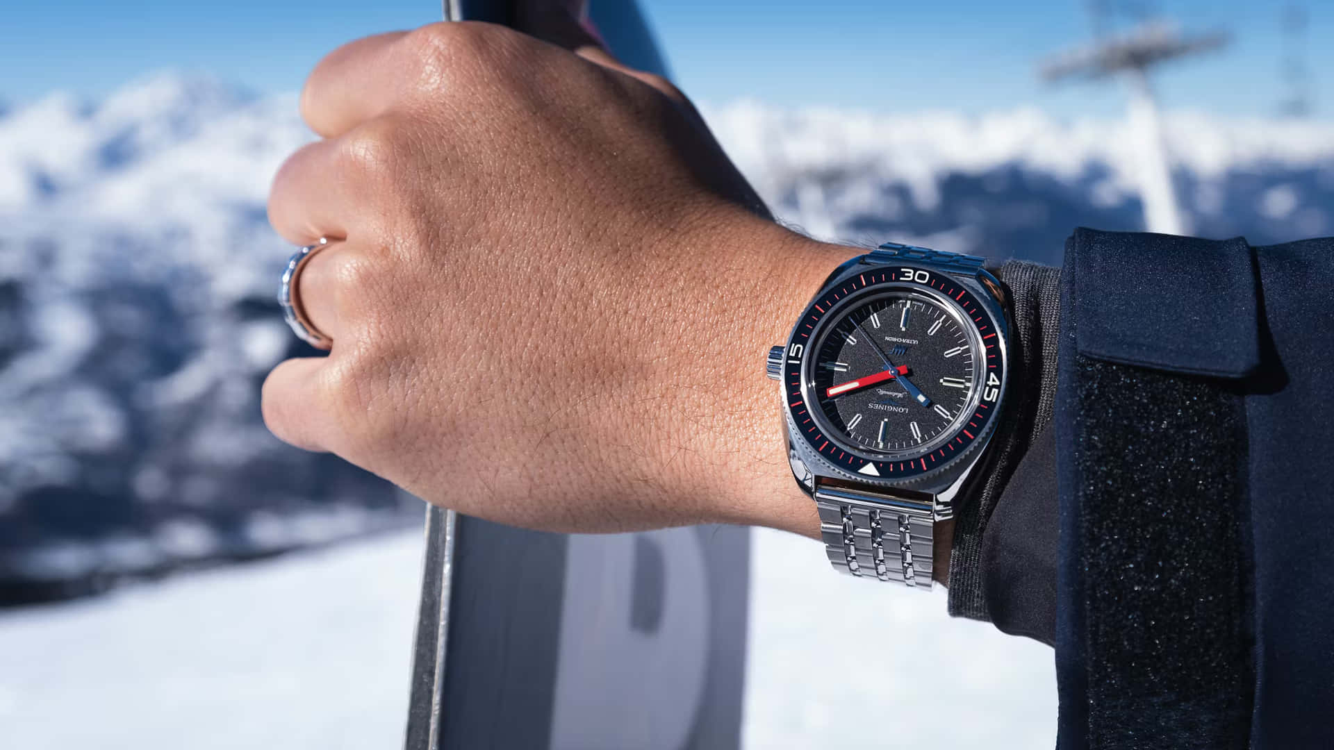Elegant Wristwatch Snowy Mountain Backdrop Wallpaper