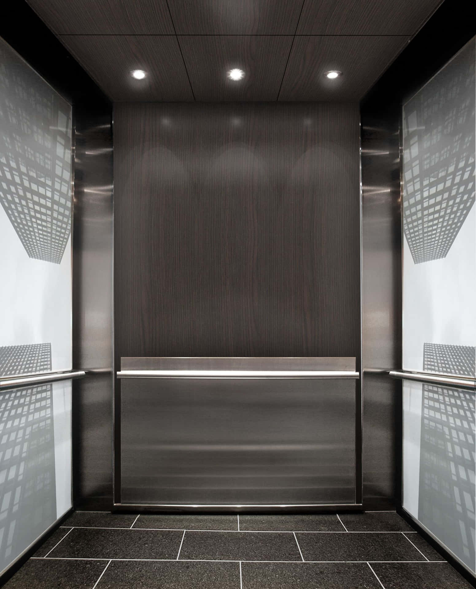 An Elevator With A Black Floor