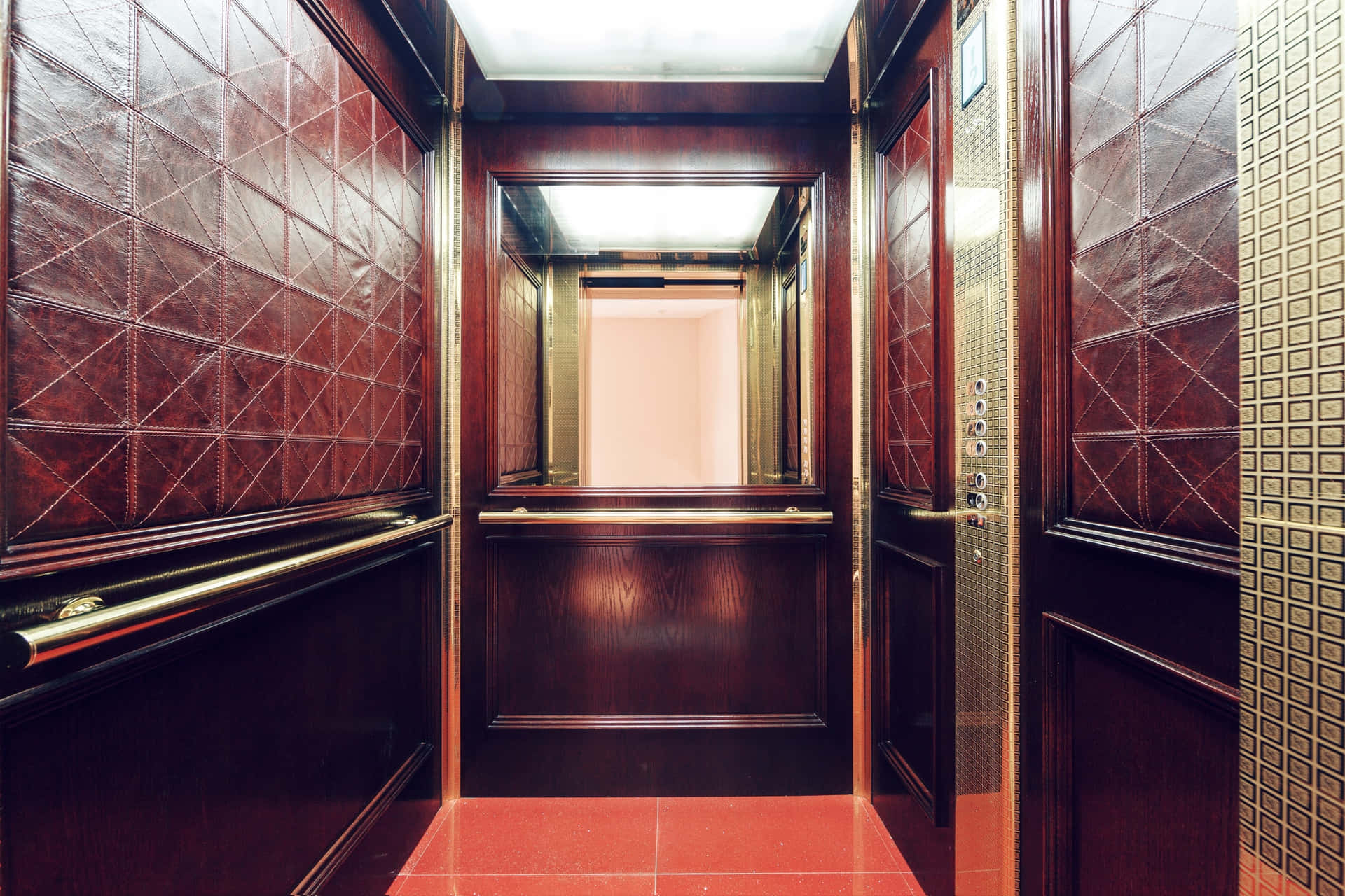 A Wooden Elevator With Red Tile