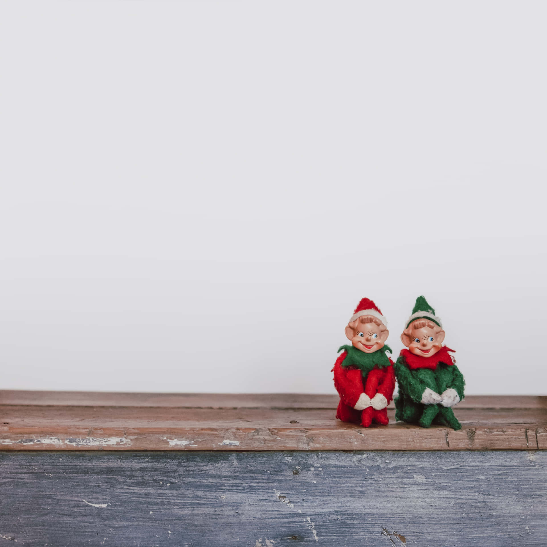 Two Elf Sat On A Wooden Bench