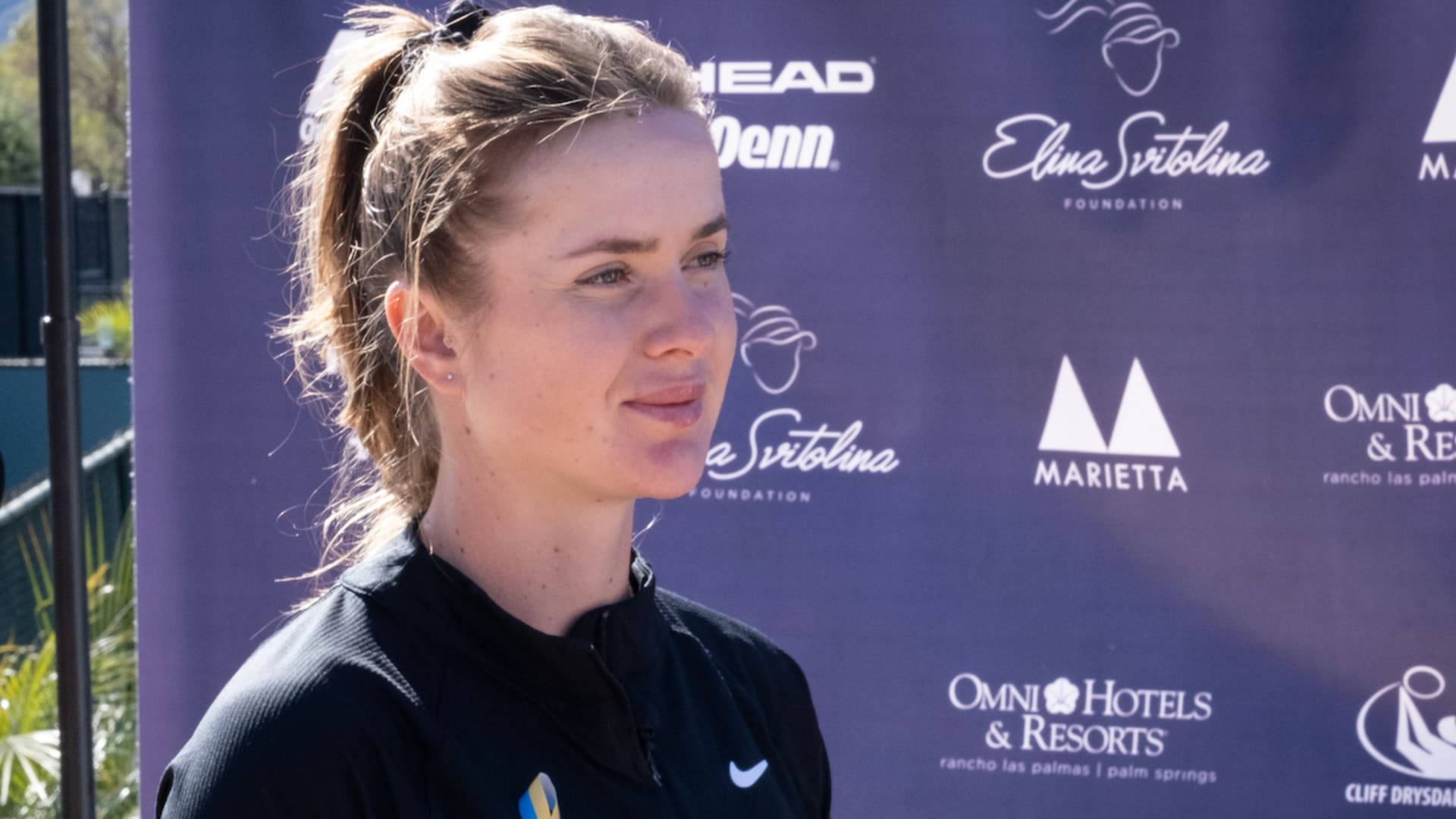 Professional Tennis Player Elina Svitolina Engaging in an Interview Wallpaper