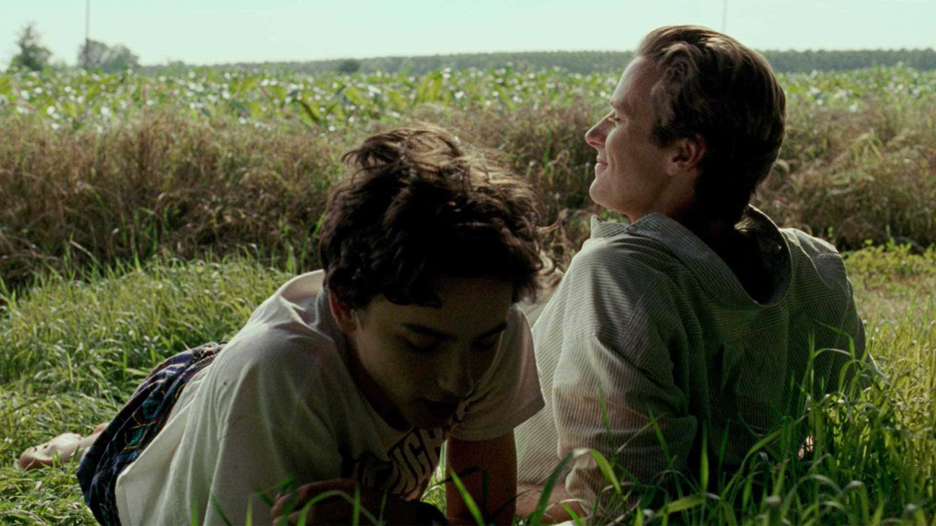 "elio And Oliver Enjoying A Sunny Outdoors In 'call Me By Your Name'" Wallpaper