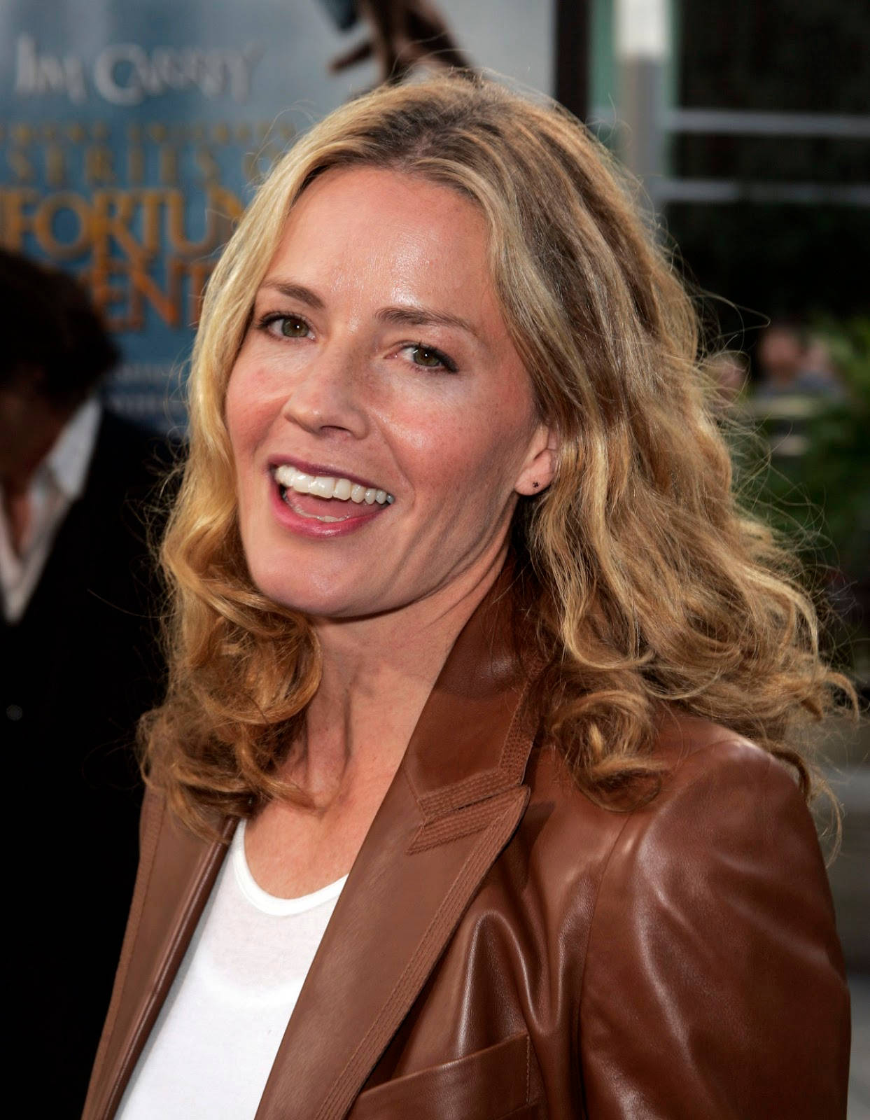 Download Elisabeth Shue Wearing Brown Leather Coat Smiling With Mouth Open  Wallpaper 