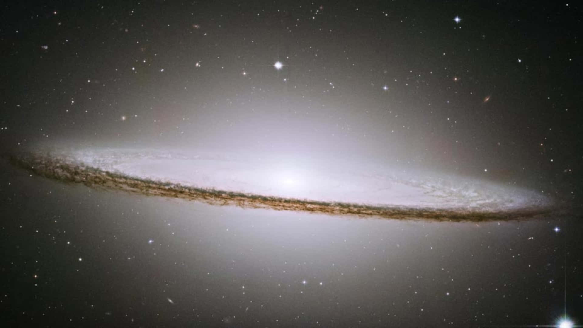 Majestic Elliptical Galaxy in Night Sky Wallpaper