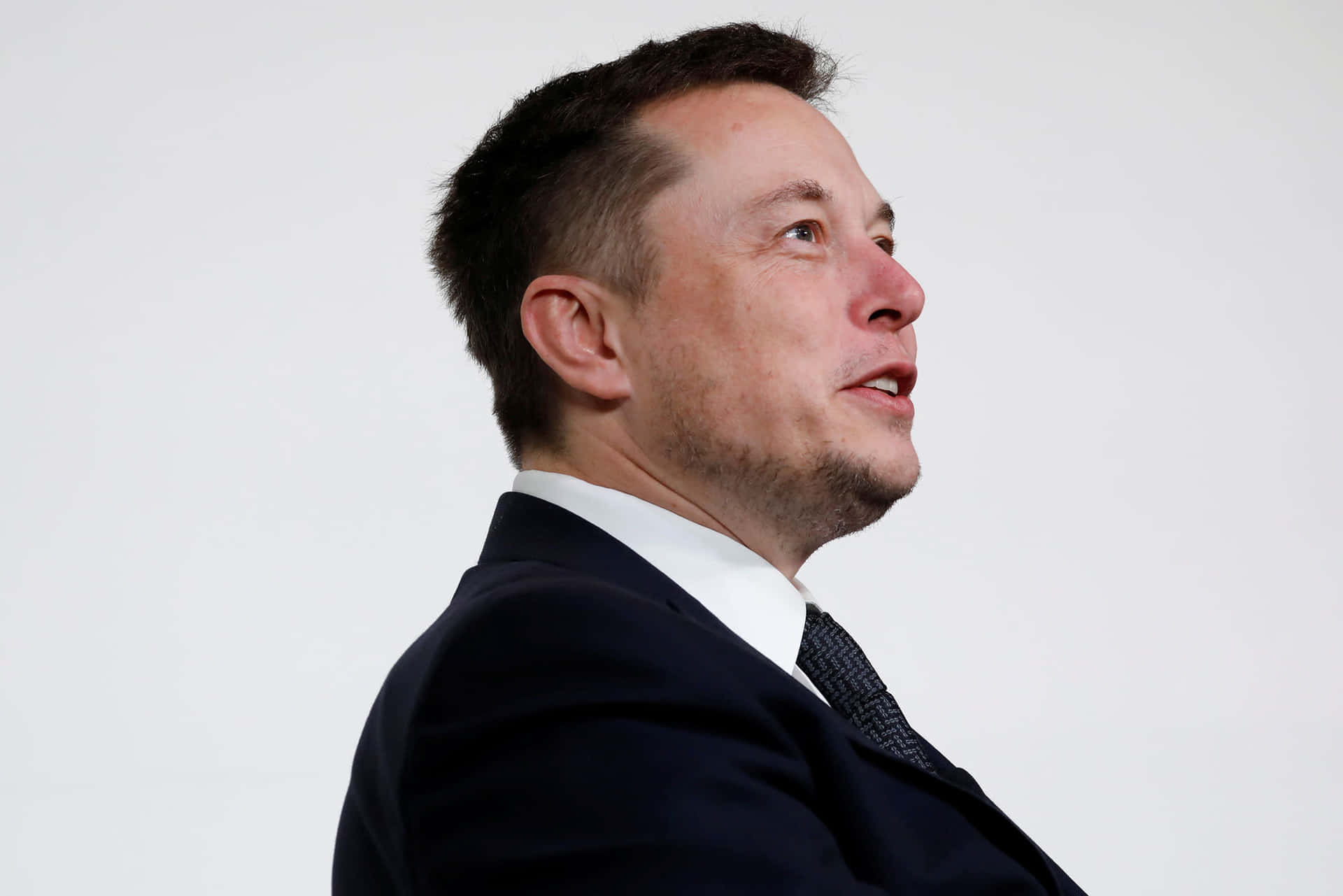 Elon Musk In A Suit And Tie