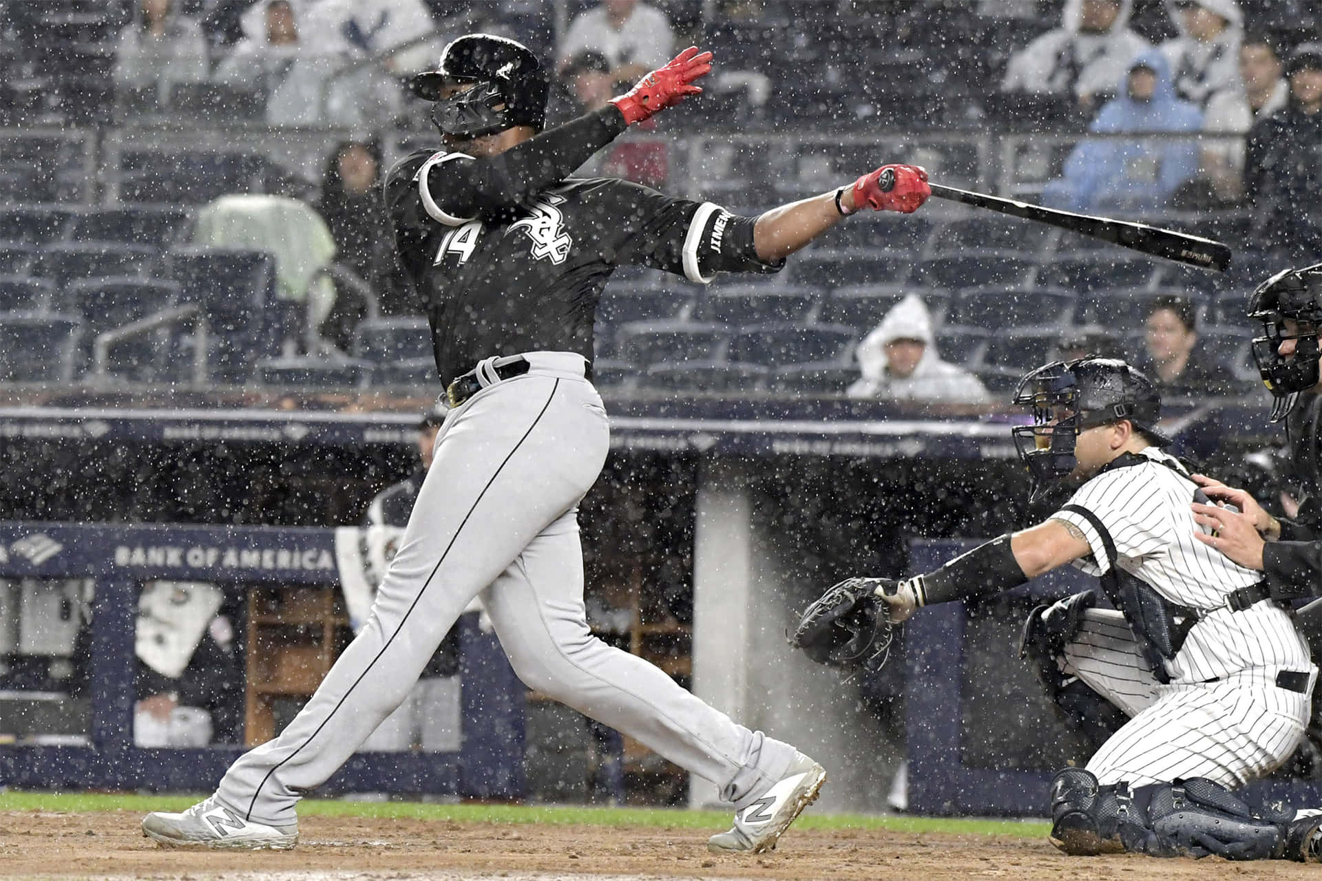 Eloy Jimenez Swingingin Rainy Baseball Game Wallpaper