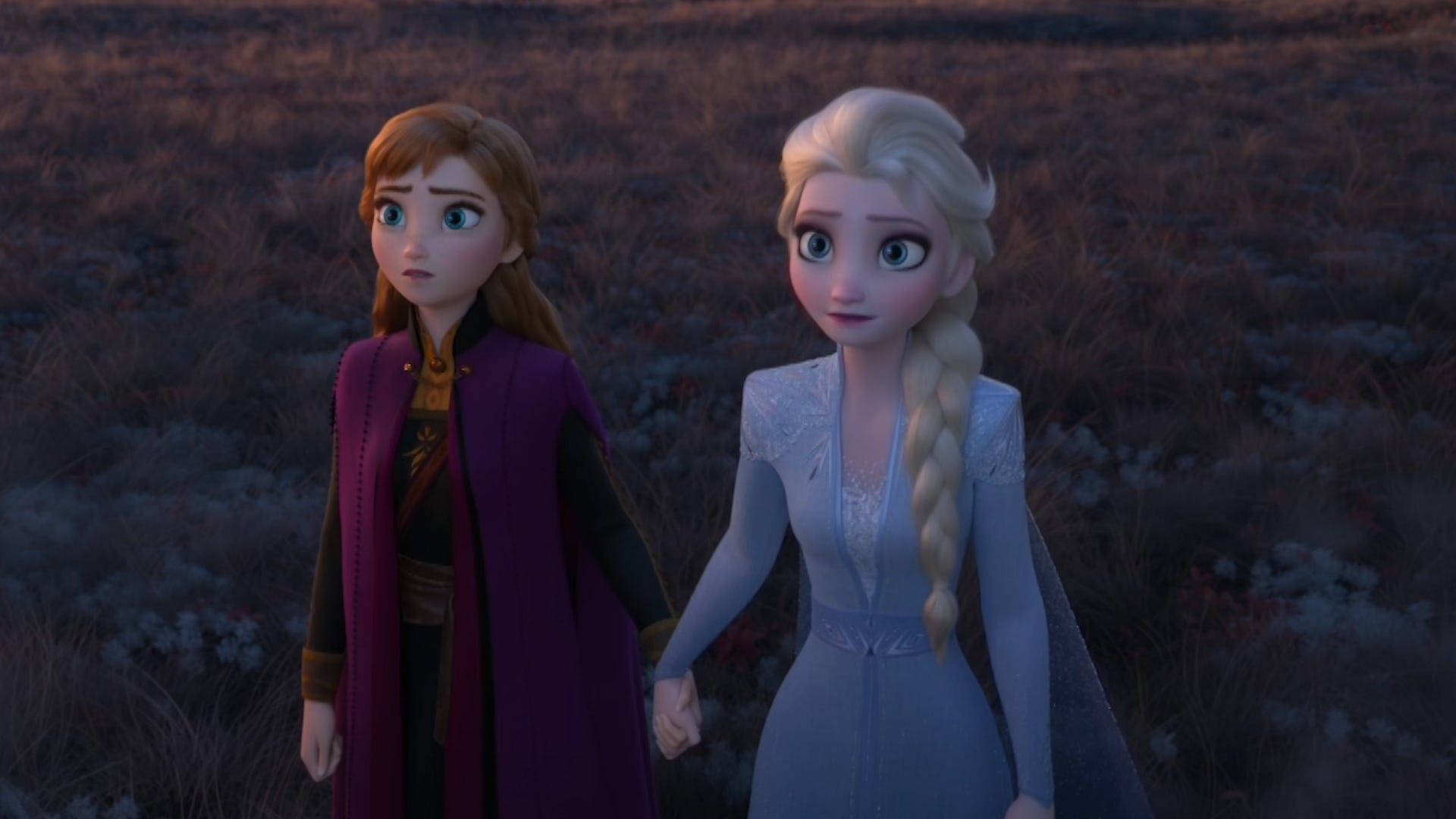 Queen Elsa and Princess Anna embark on an epic journey in Disney's Frozen 2 Wallpaper