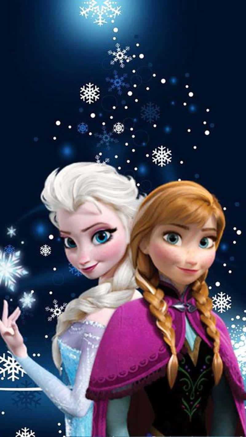 Two Frozen Princesses Standing In Front Of A Snowflake Wallpaper