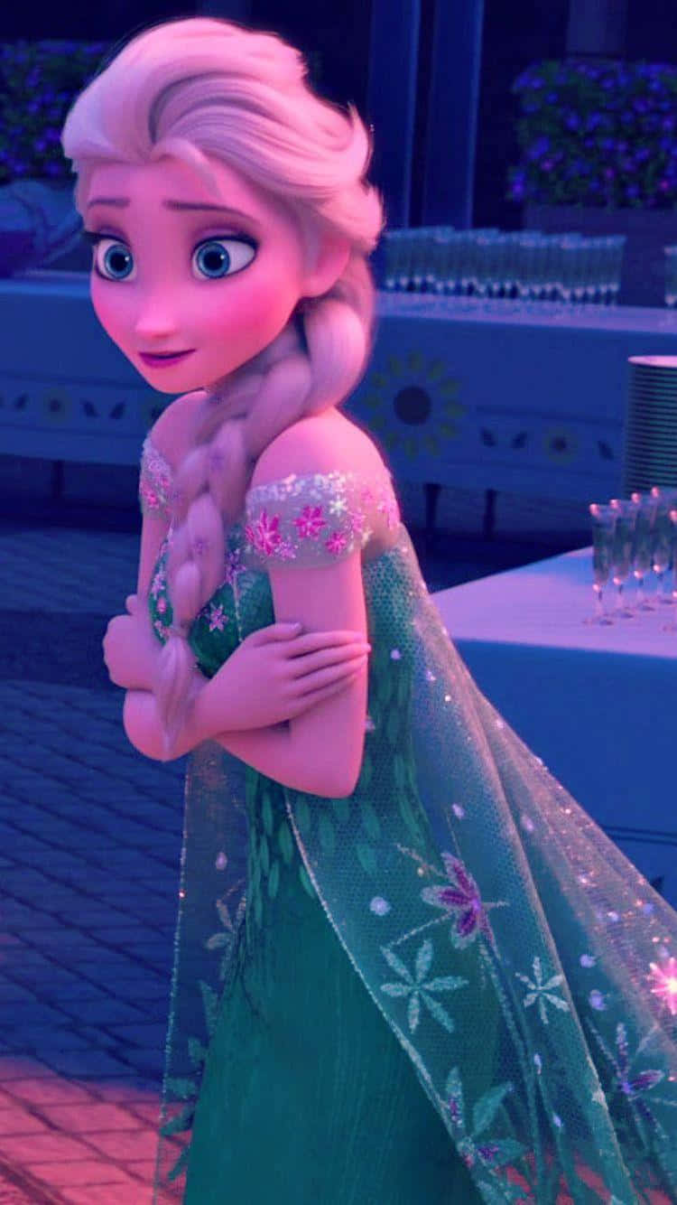 Elsa In A Green Dress Standing In Front Of A Table Wallpaper