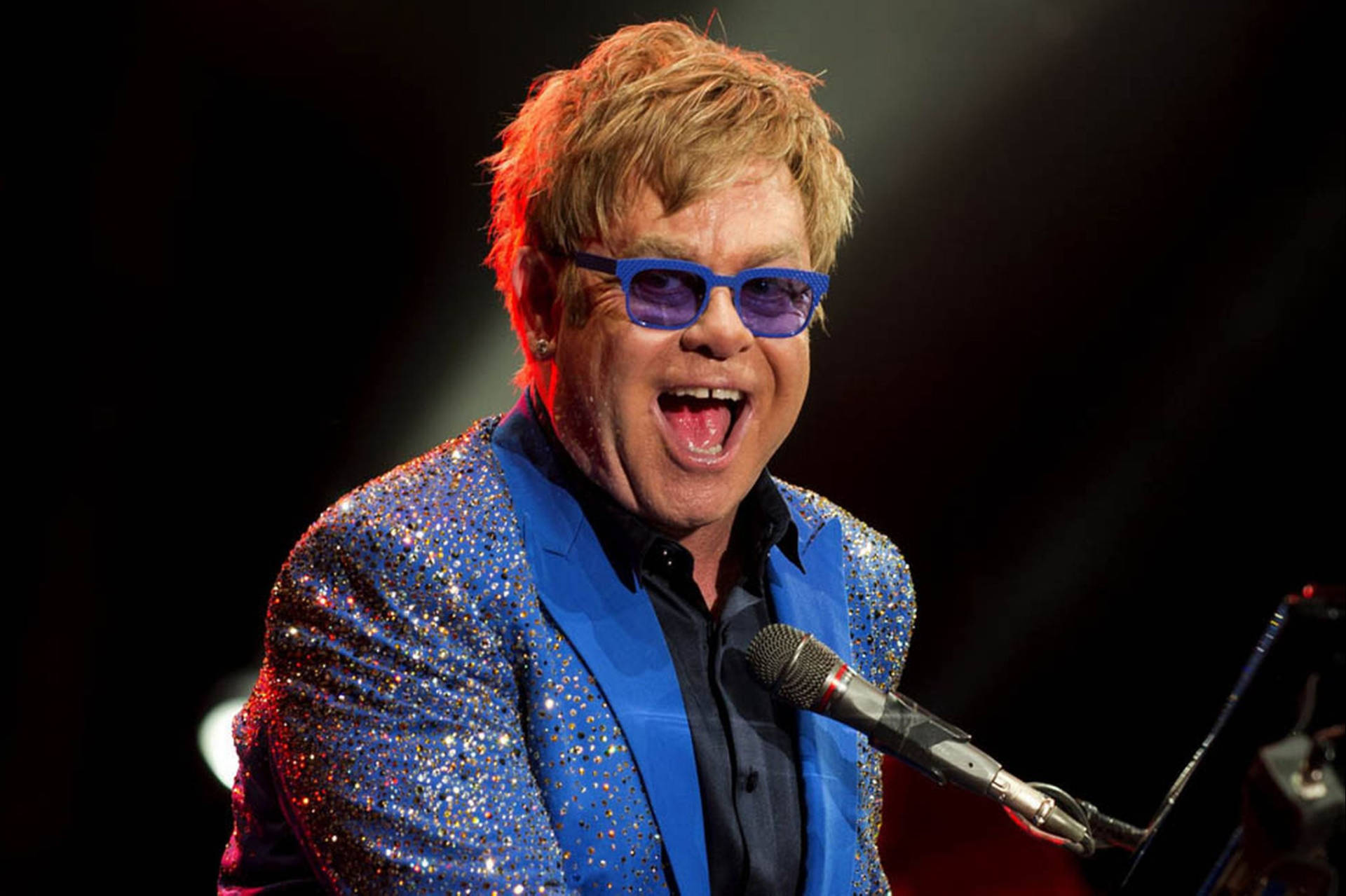Elton John Blue Suit Concert Background