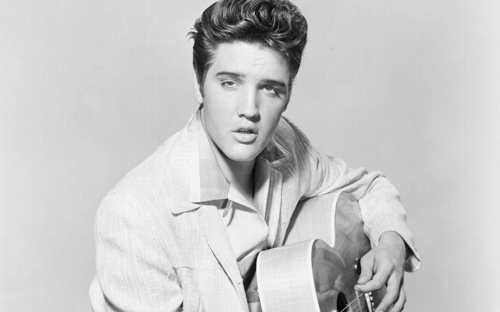 Elvis Presley With His Guitar Wallpaper