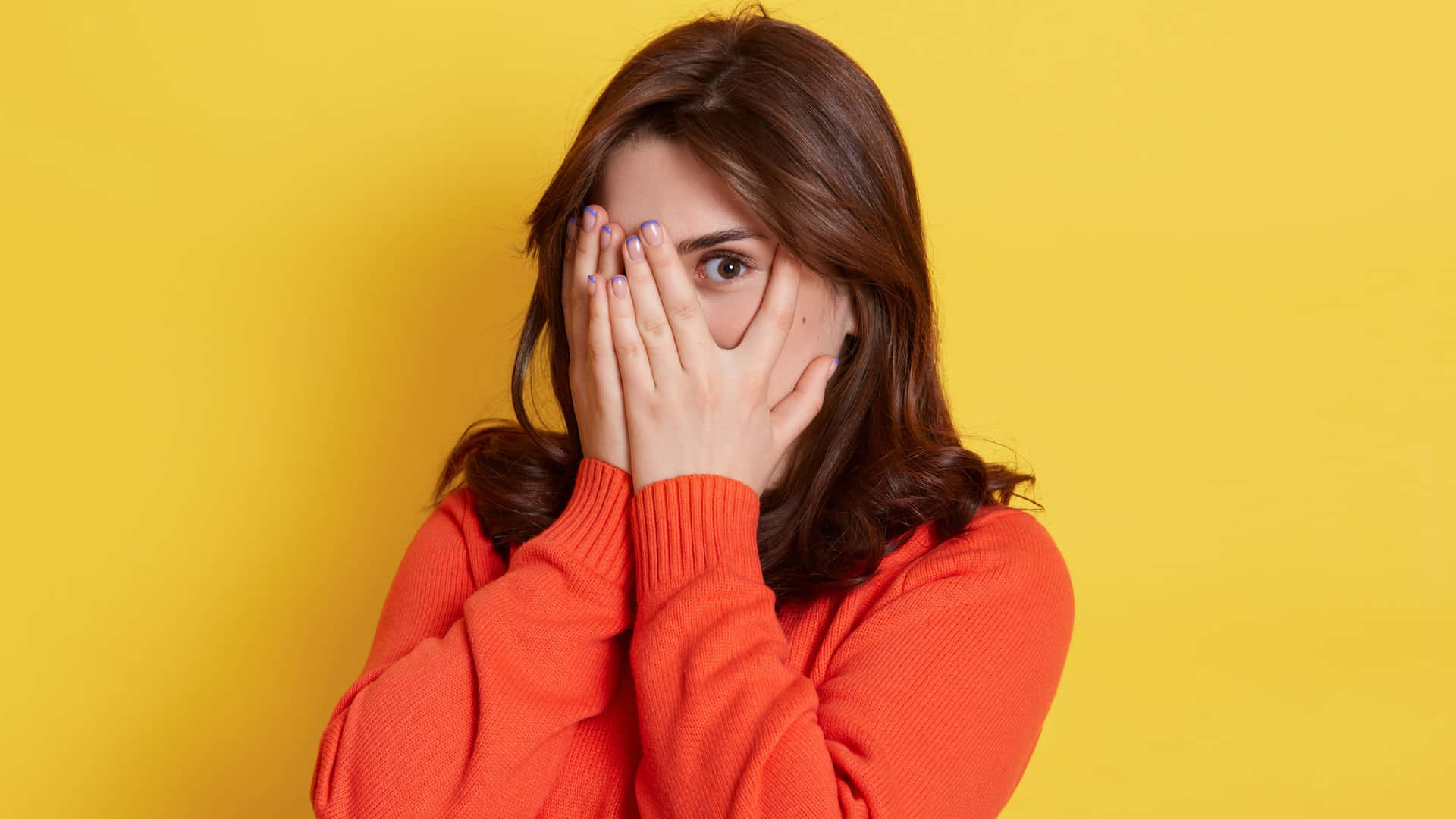 Embarrassed Woman Covering Face Wallpaper