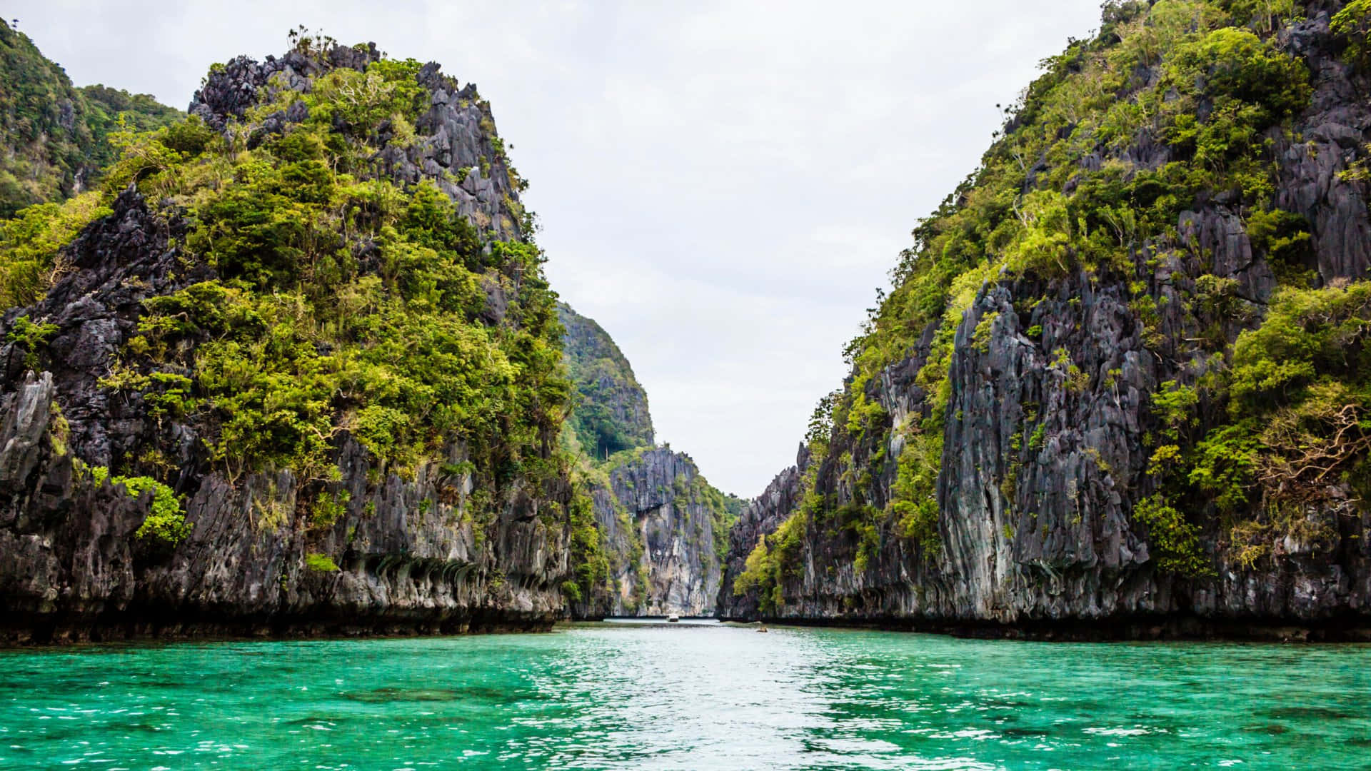 Emerald_ Waters_ Between_ Limestone_ Cliffs Wallpaper