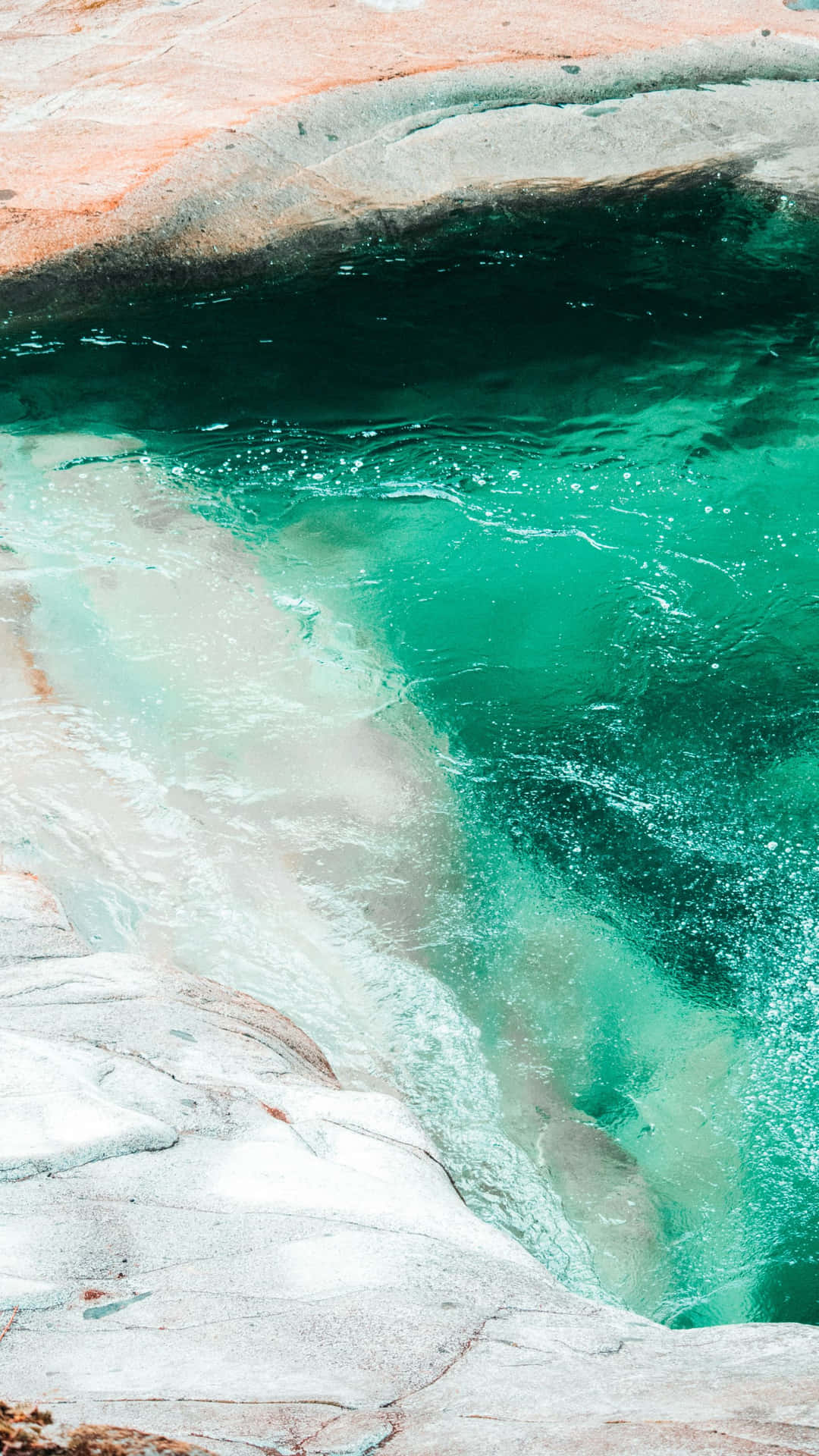 Emerald Waters Rocky Shoreline.jpg Wallpaper