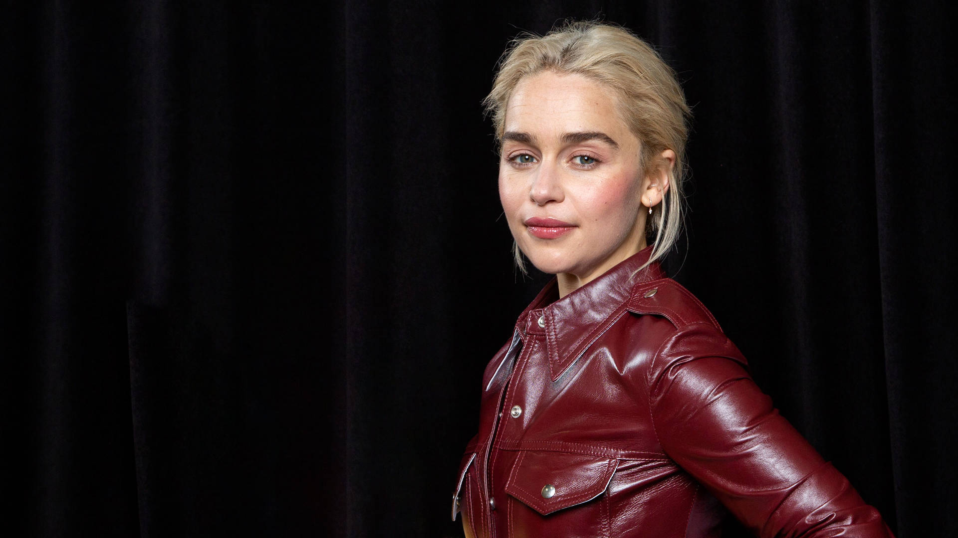 Emilia Clarke In Leather Outfit Wallpaper