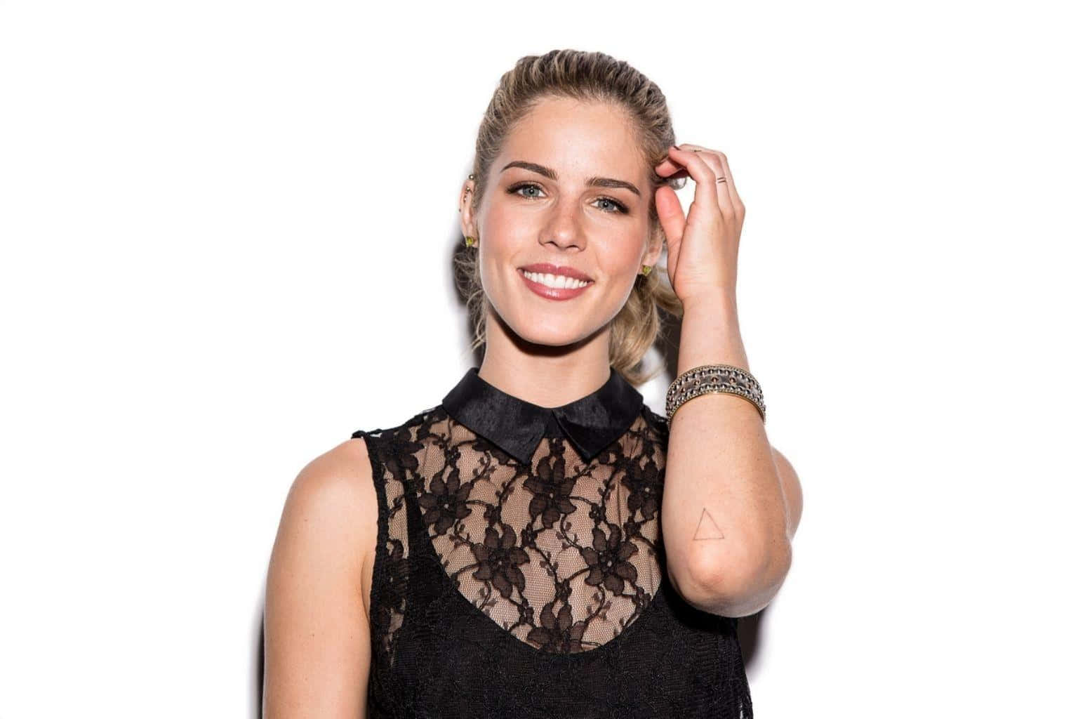 Emily Bett Rickards Smilingin Black Lace Top Wallpaper