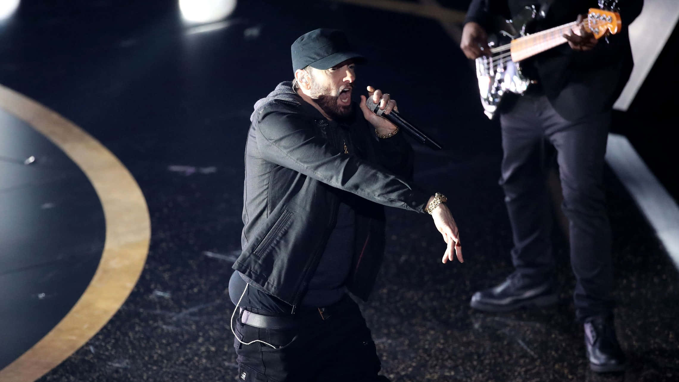 Caption: Eminem mesmerizes the crowd during a live performance