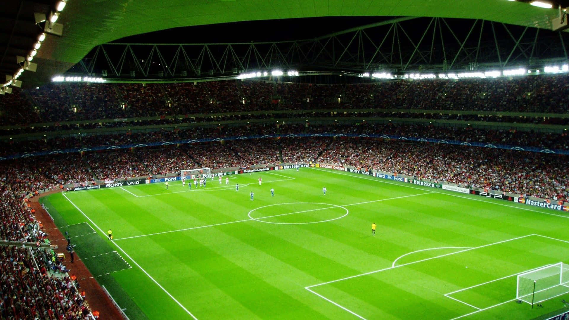 Emiratesstadium Fotbollsplan I England. Wallpaper