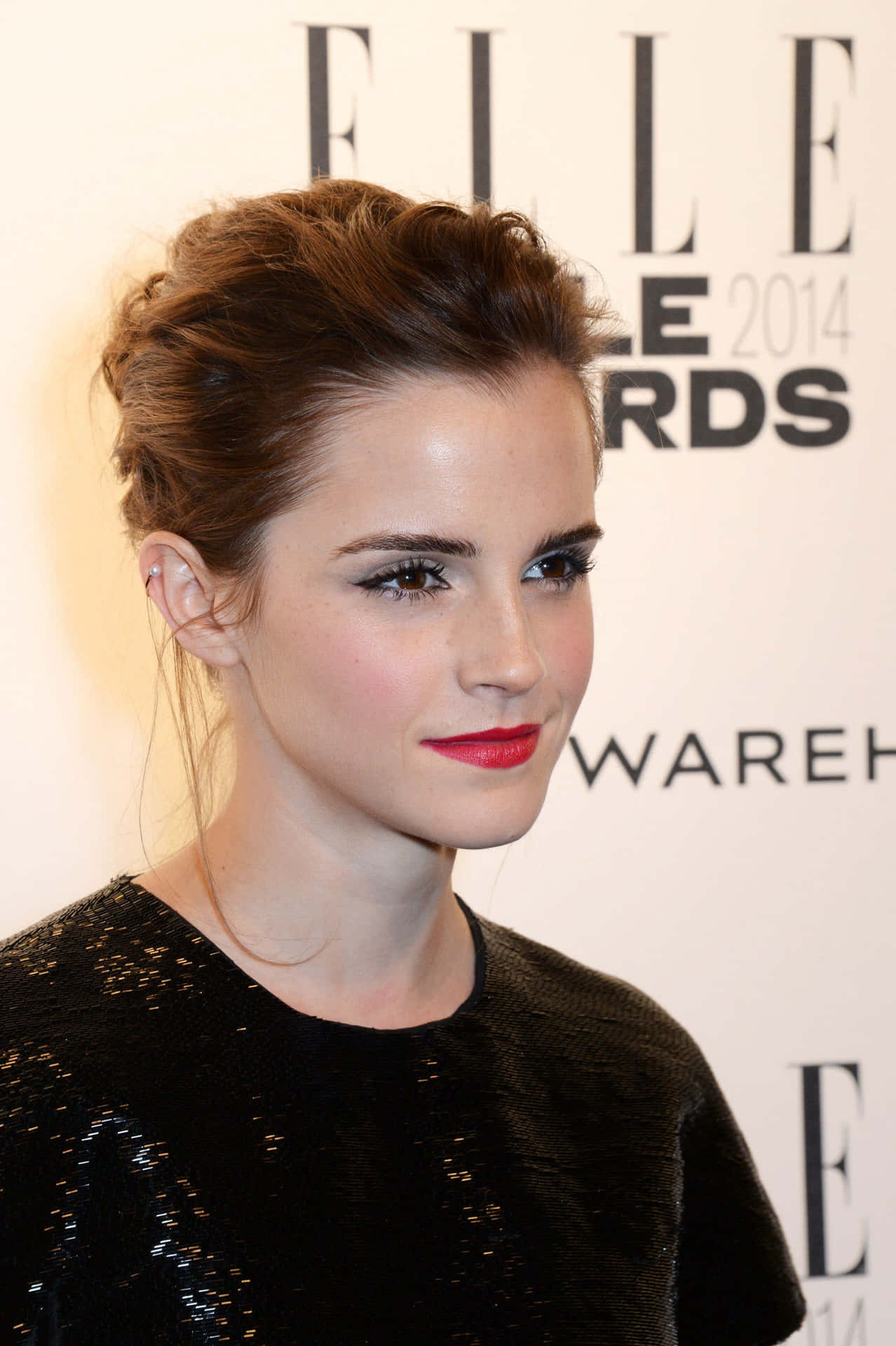 Emma Watson striking a pose during a glamorous photoshoot