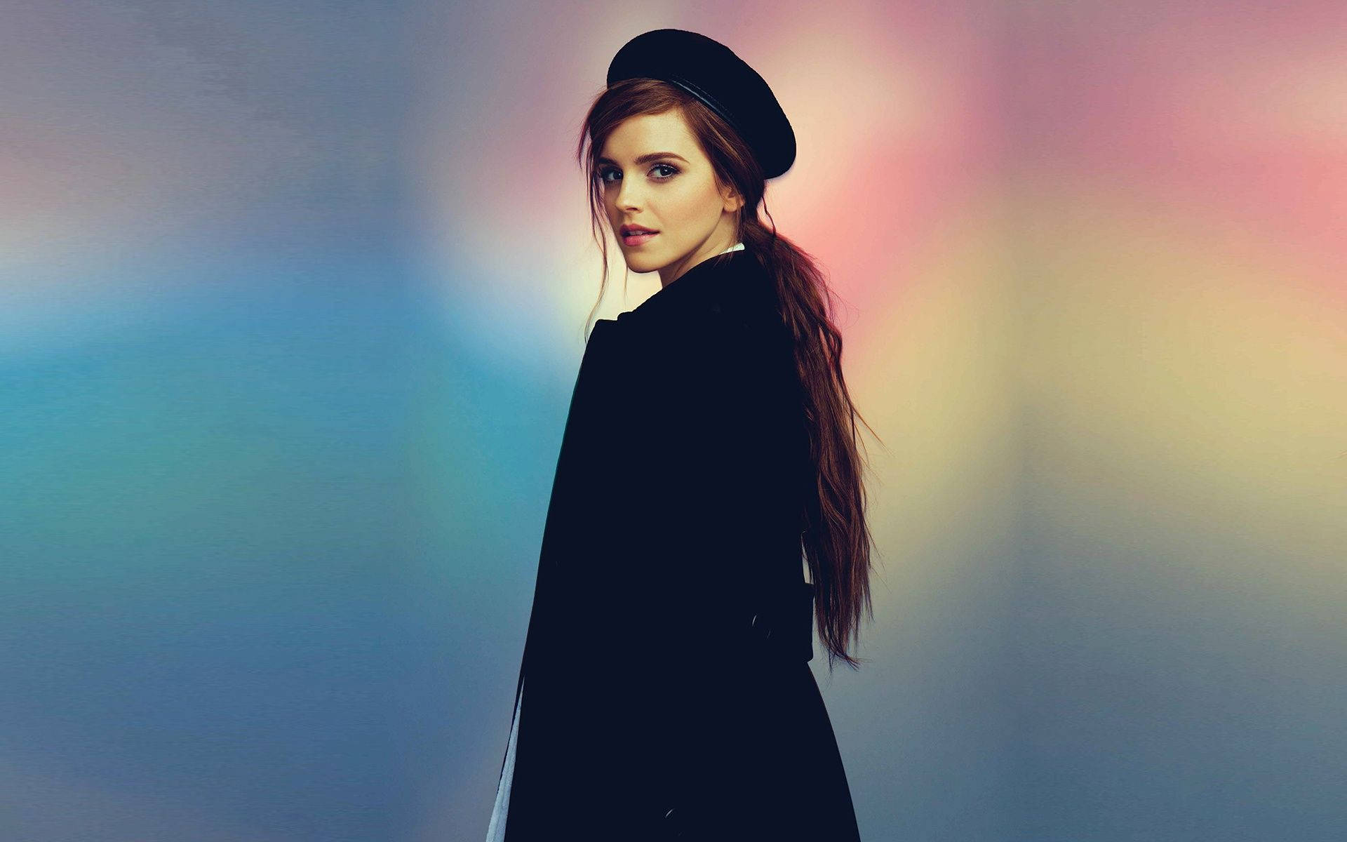 Emma Watson posing in a black beret. Wallpaper