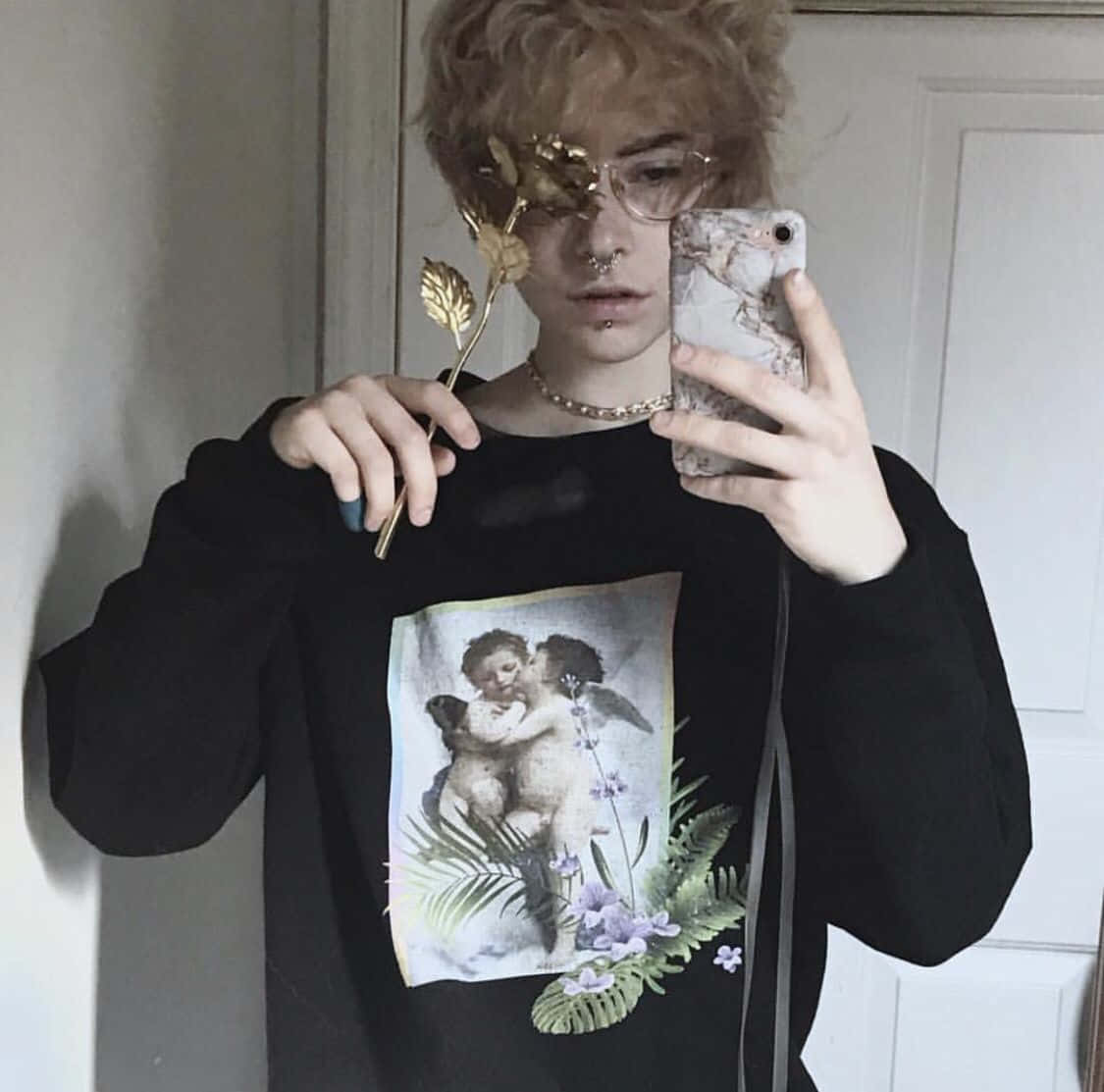 A Girl Wearing A Black Sweatshirt With A Picture Of A Flower