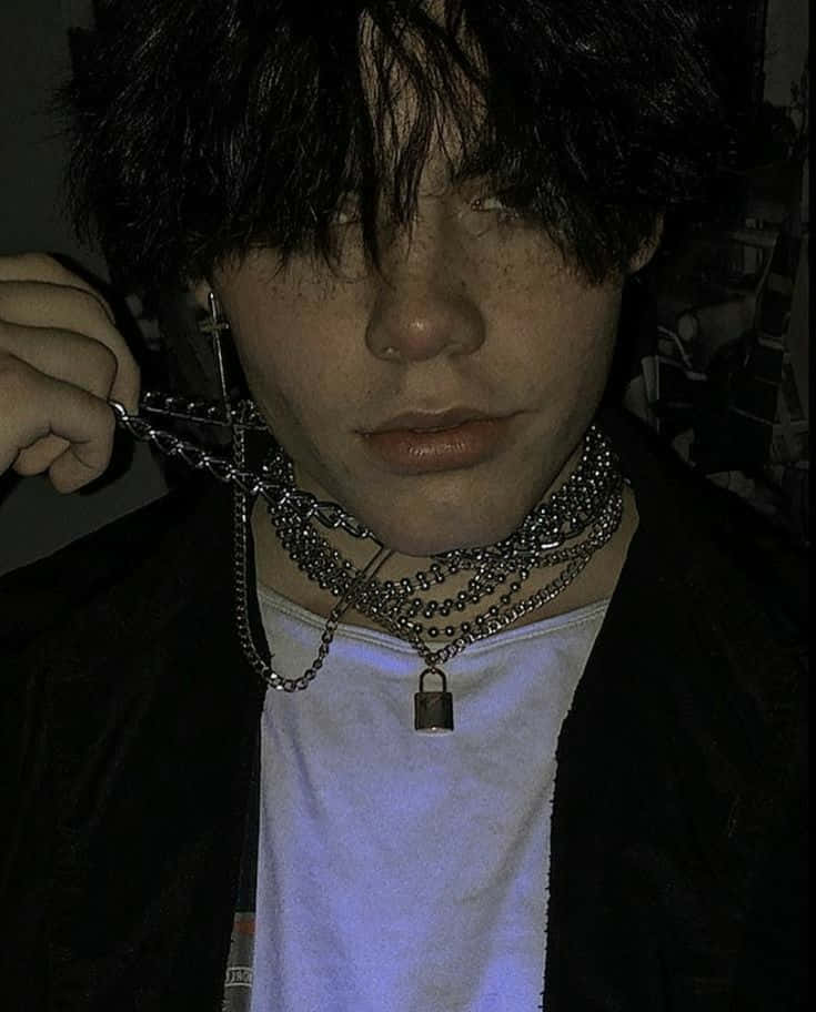 A Young Man With A Chain Necklace