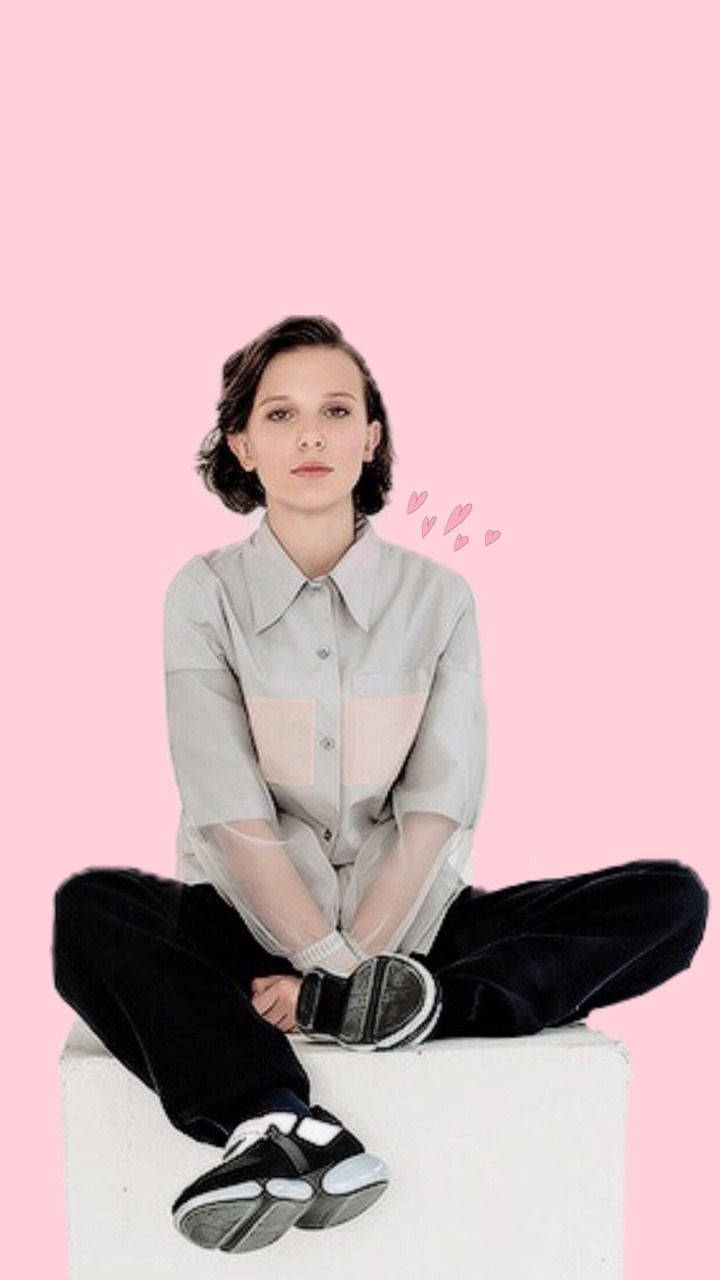 Millie Bobby Brown poses in an edgy, vibrant outfit Wallpaper