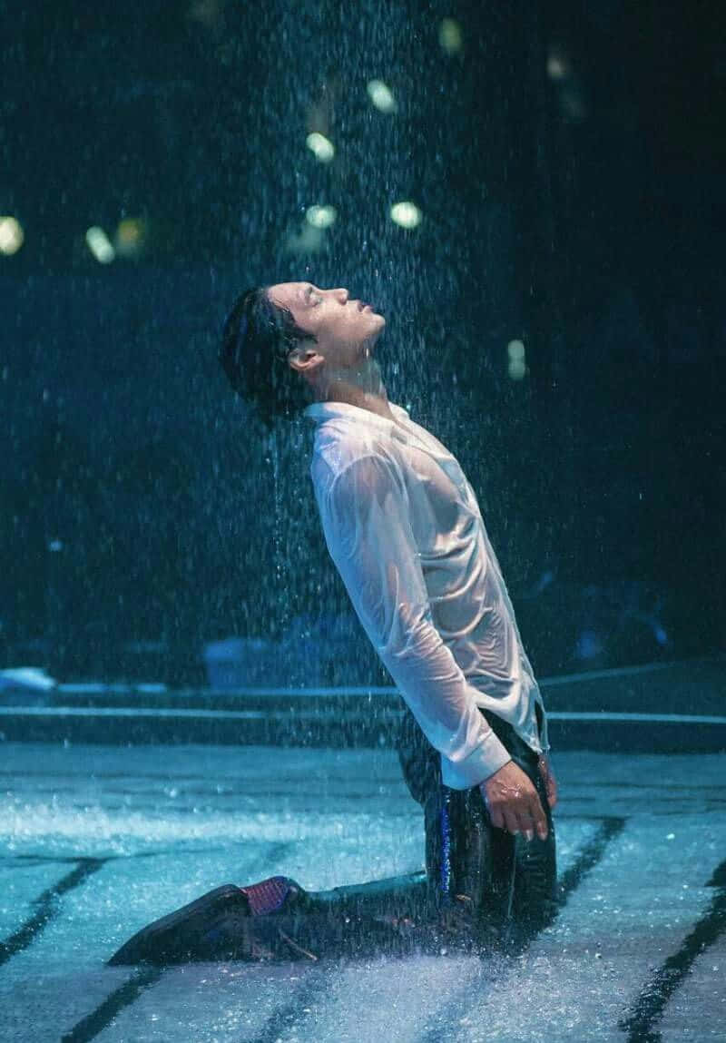 Emotion Man Kneeling While Raining Picture