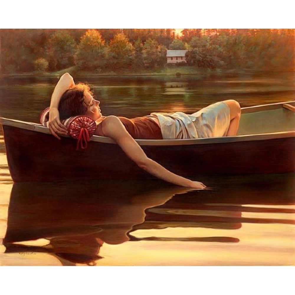 Imagende Una Mujer Descansando En Un Bote En Emotion Lake.