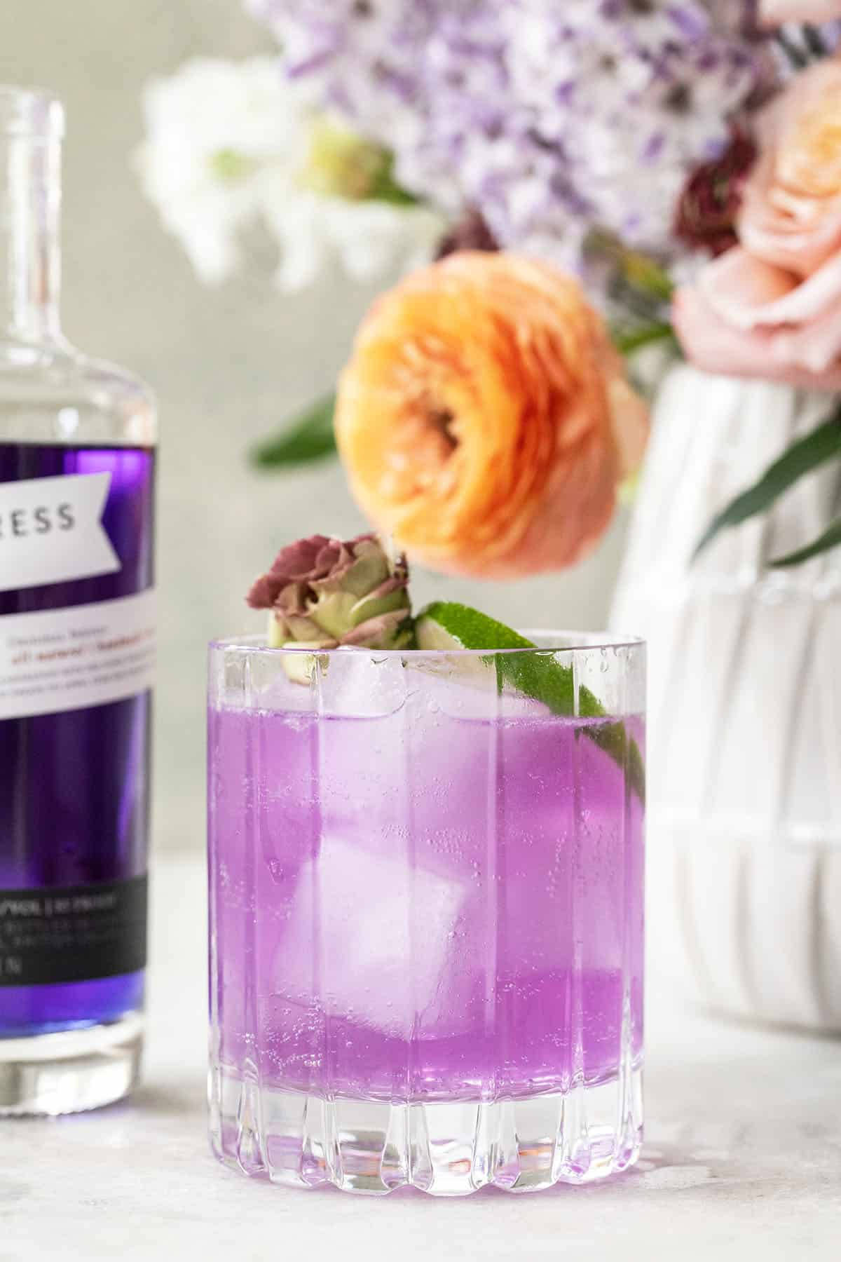 Empress Gin On Rocks Glass With Flowers Wallpaper