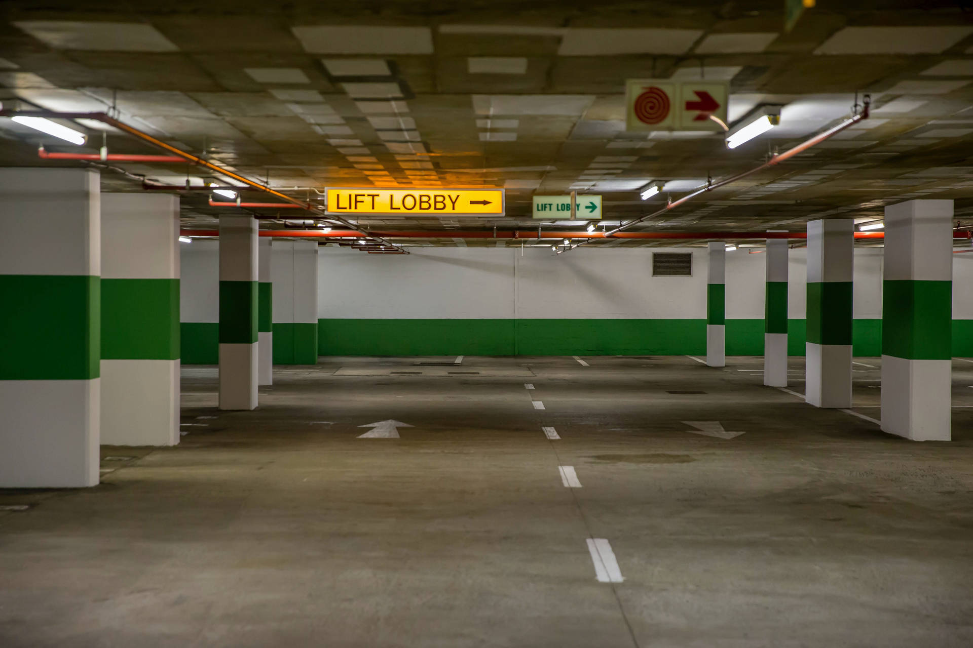 Vast Empty Underground Parking Area Wallpaper