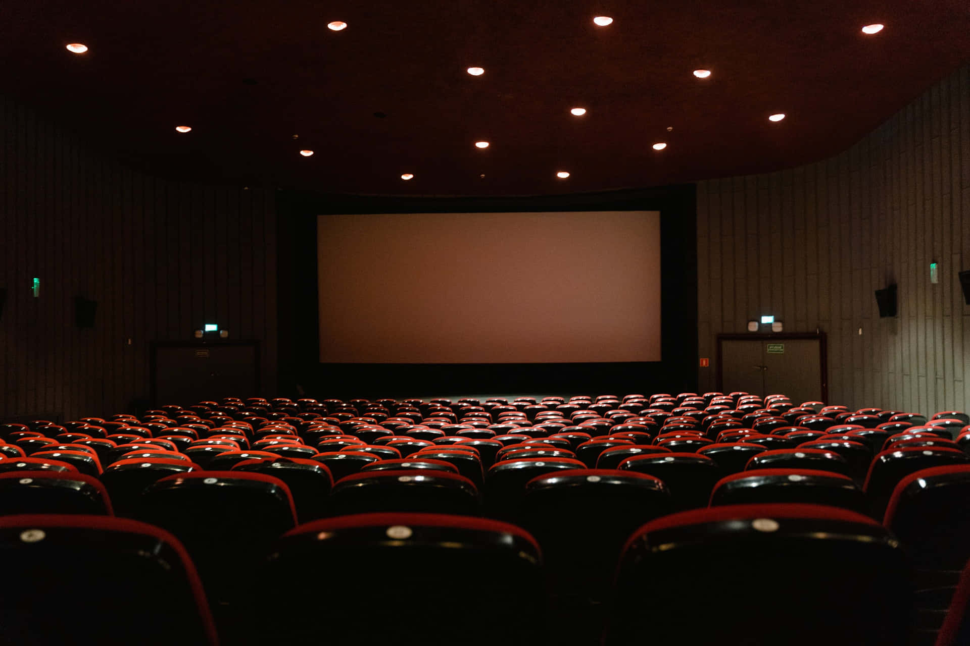 Download Empty Cinema Hall Interior Wallpaper | Wallpapers.com