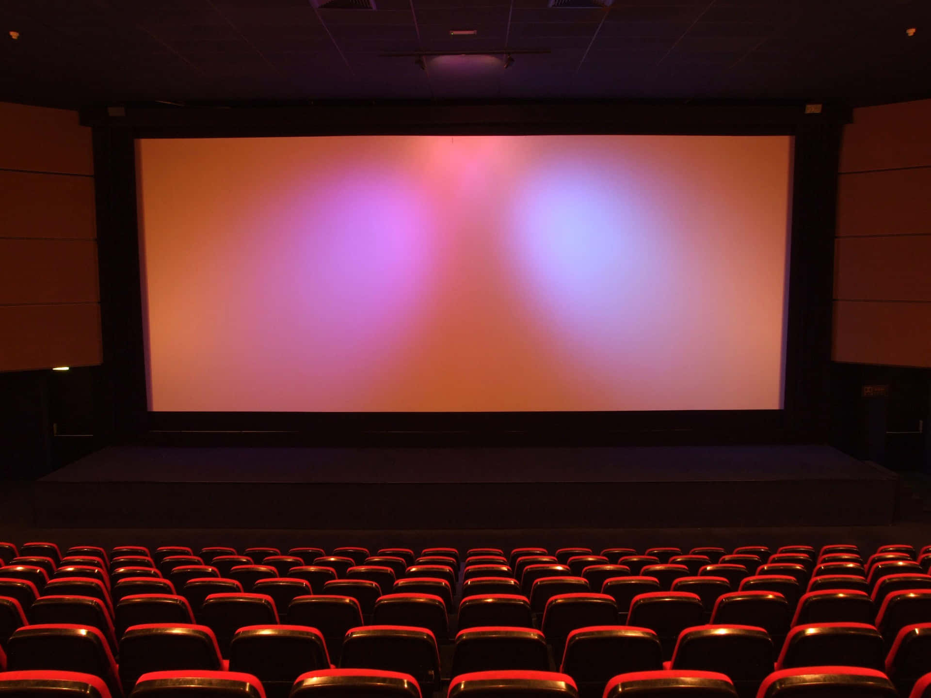 Empty Cinema Hall Red Seats Wallpaper