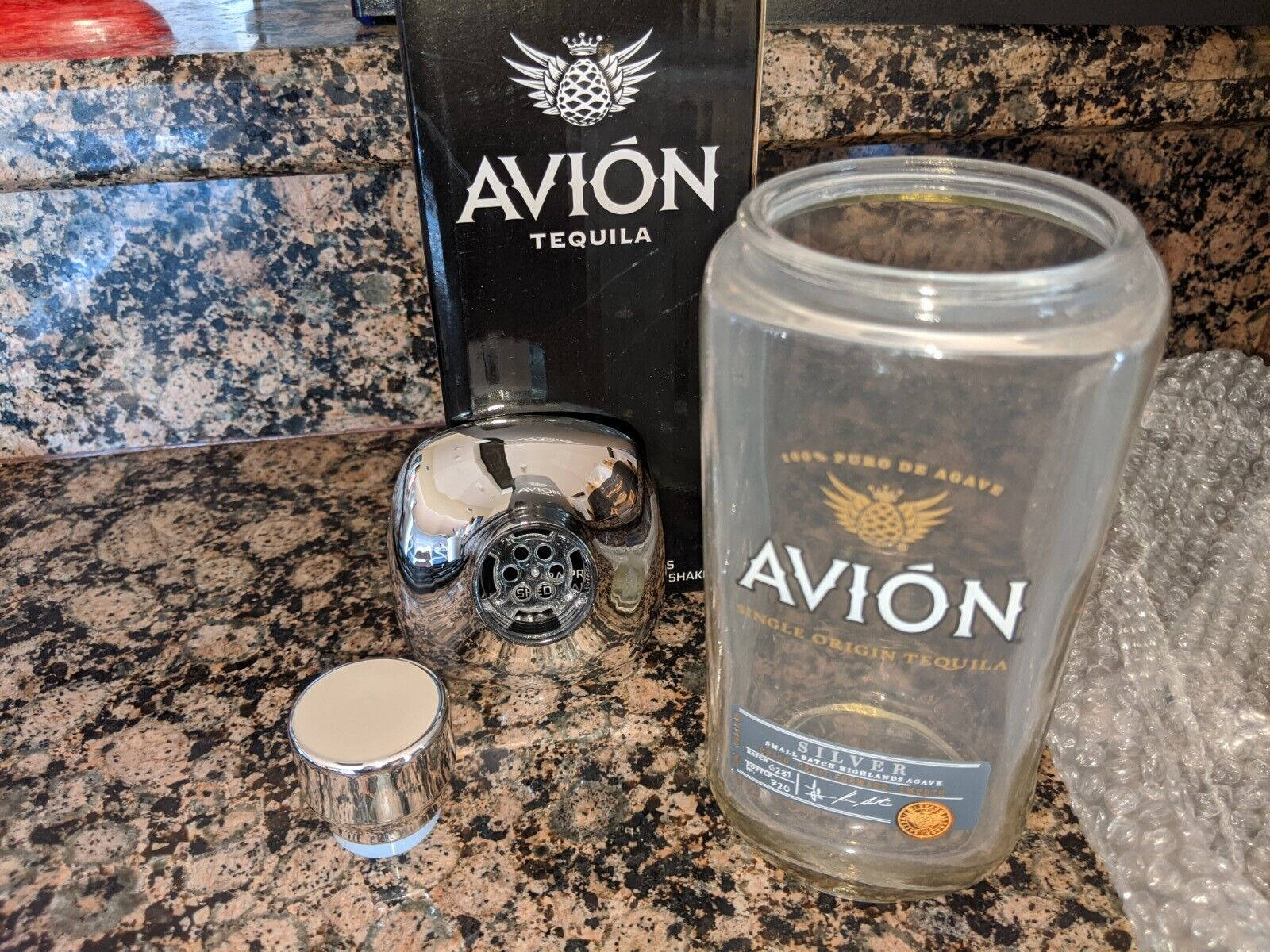 Empty Container With Avion Tequila Label Wallpaper