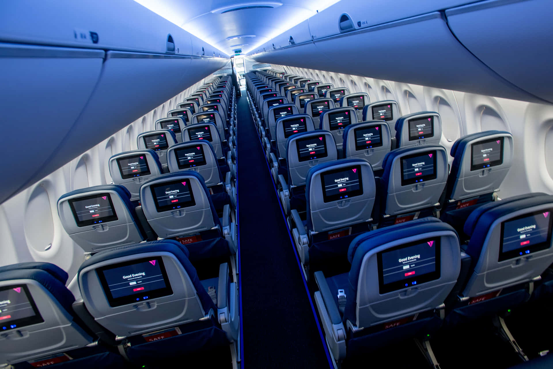 Inside an Empty Economy Class Airplane Cabin Wallpaper