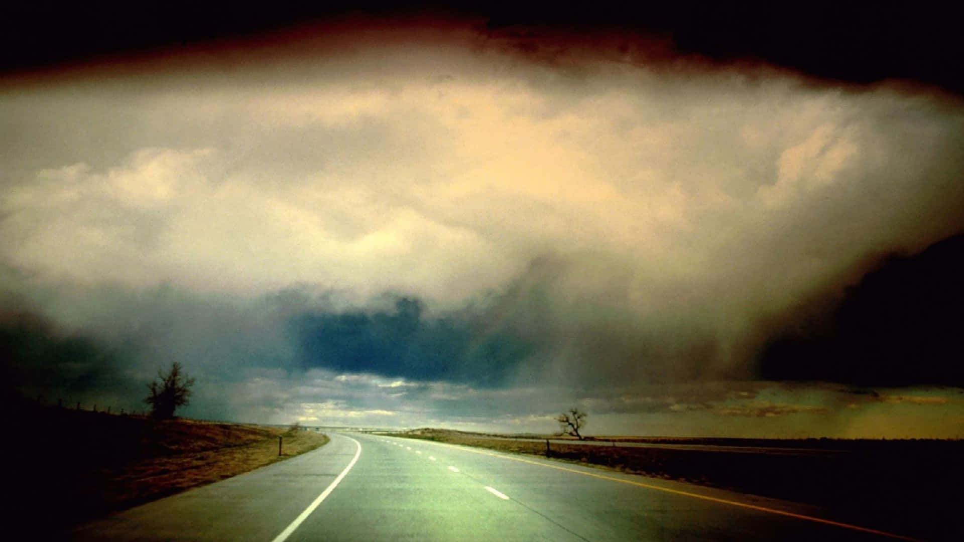 Empty Road With Storm Clouds Wallpaper