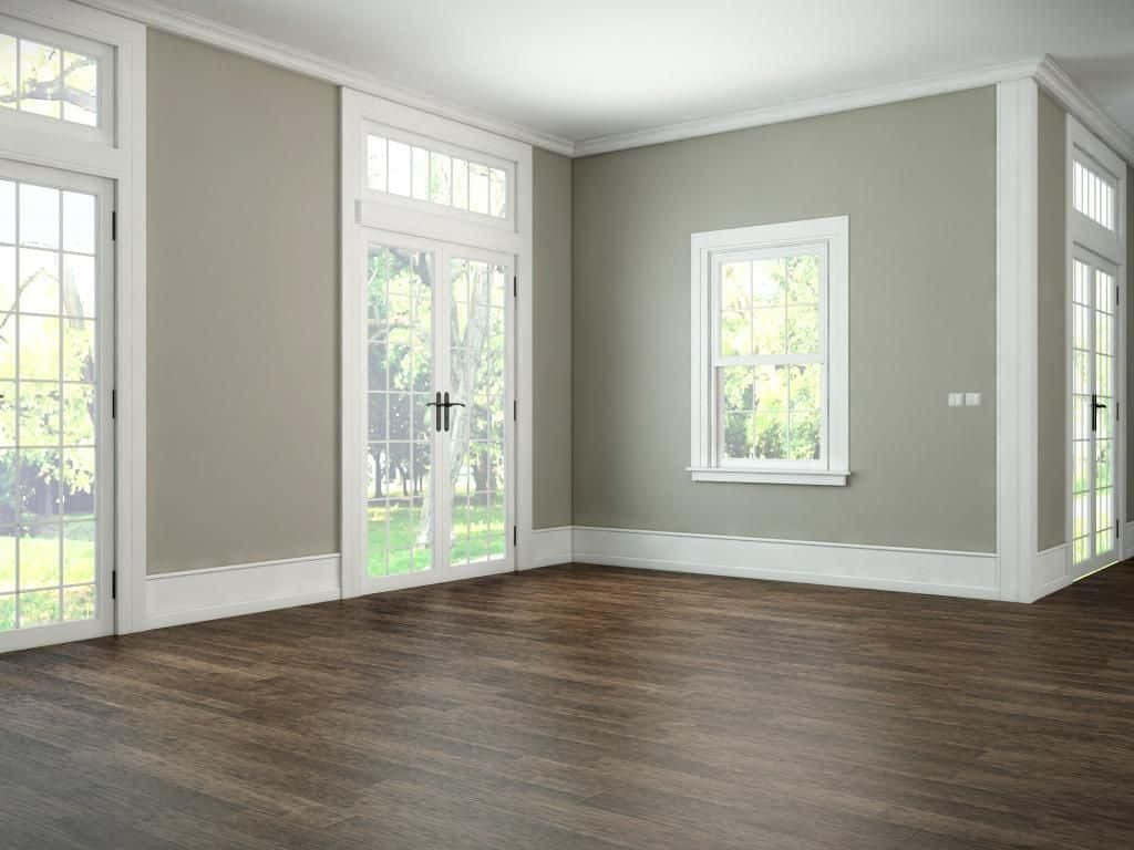 A Room With Wood Floors And Windows