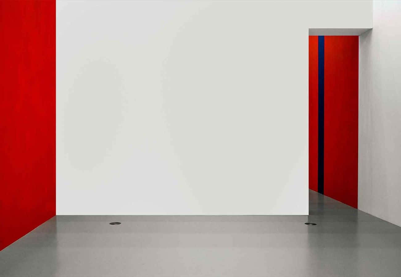 A White Wall With Red And Blue Paint
