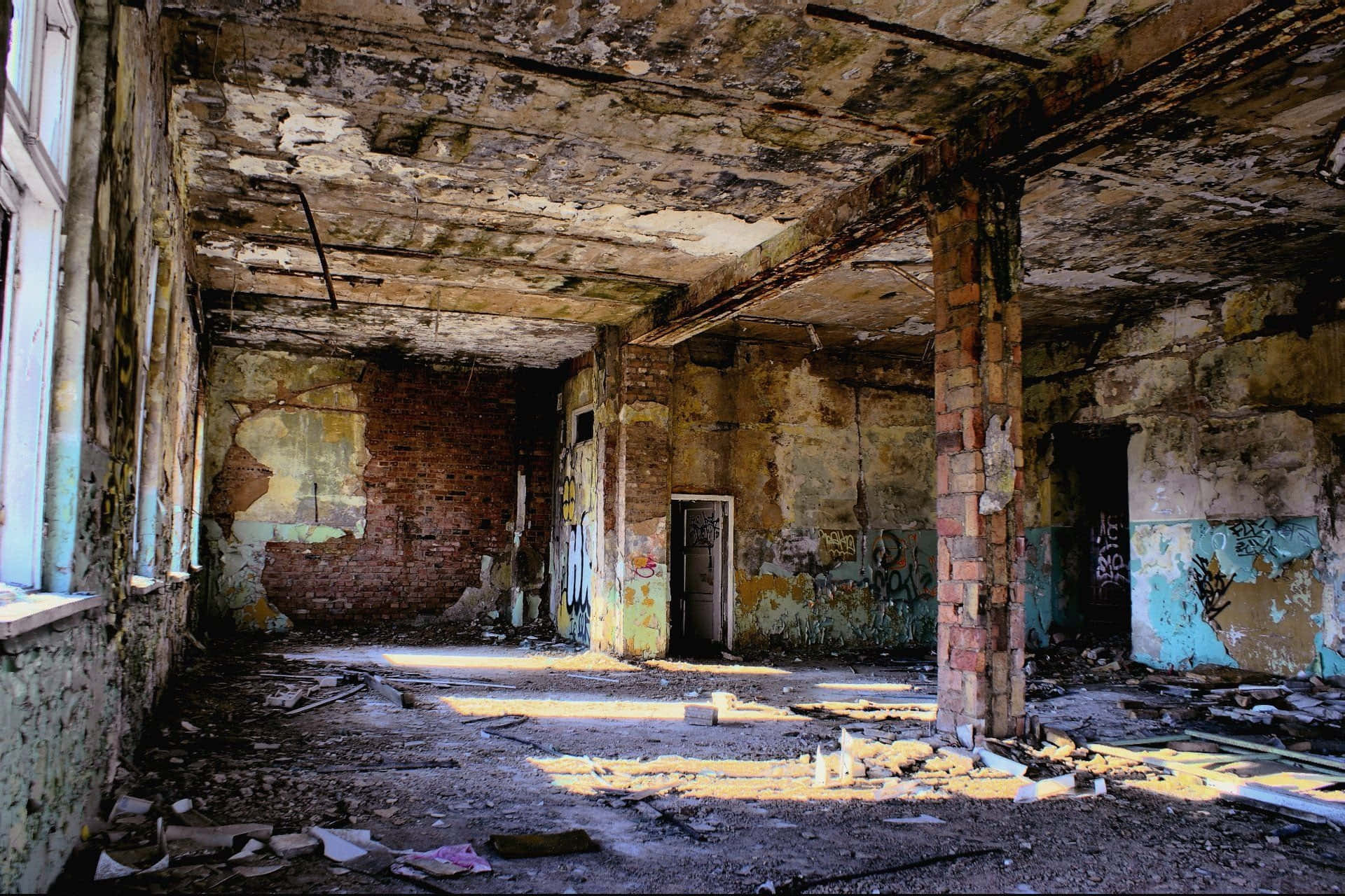 An Abandoned Building With A Broken Window